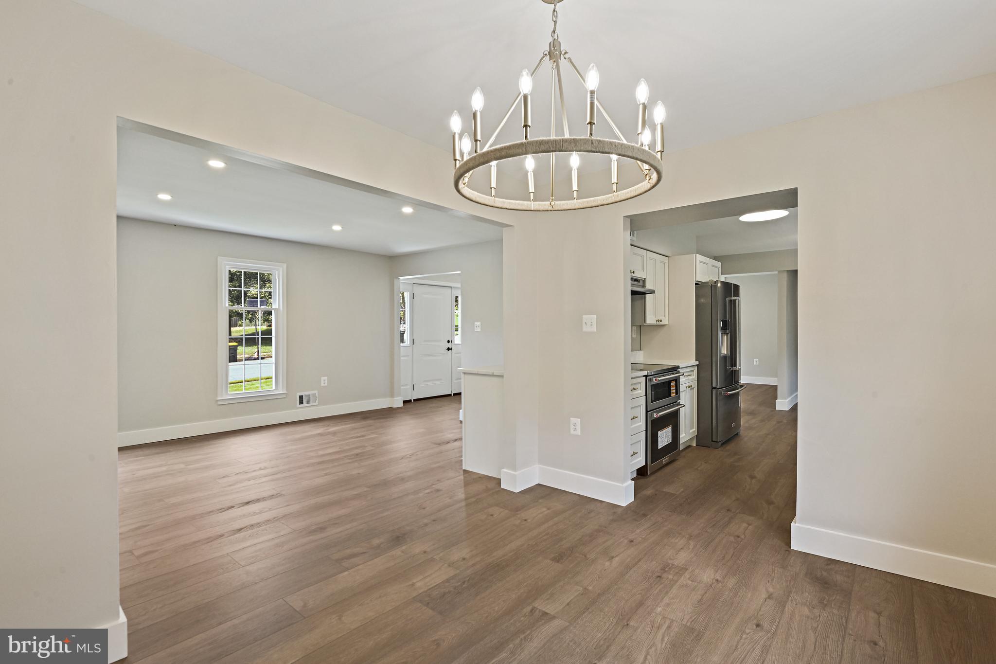 9060 Brook Ford Road Burke, VA 22015 - Photo 9 of 56 a view of an empty room and wooden floor kitchen view