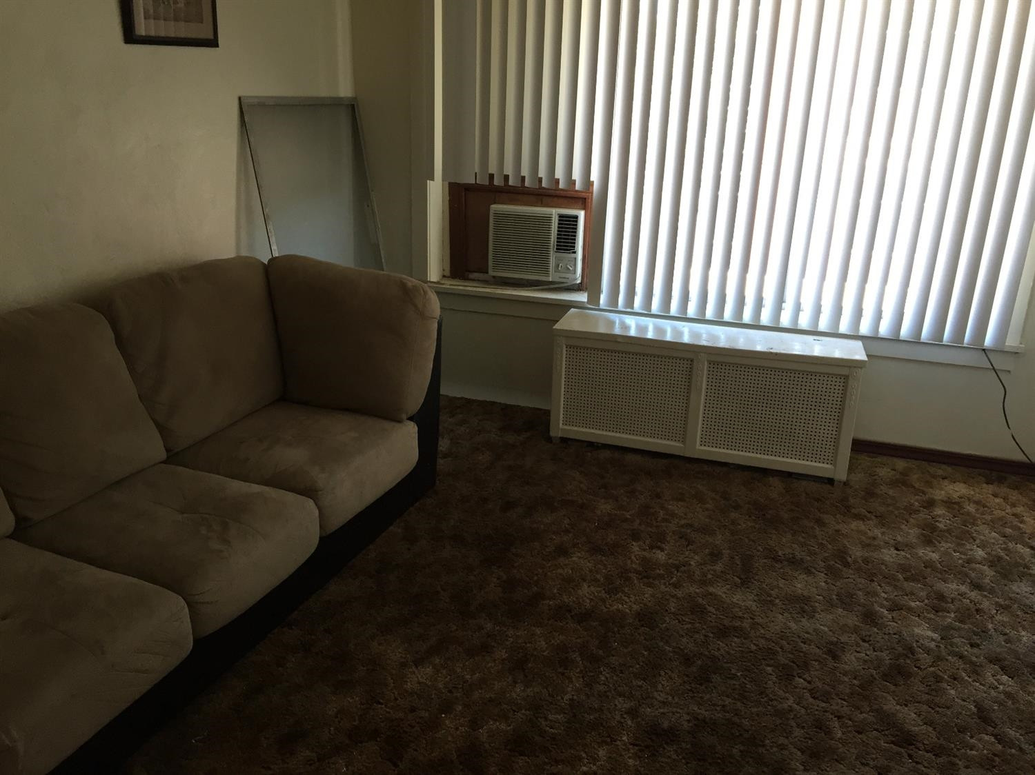 133-39 West Ridge Road Gary, IN 46408 - Photo 21 of 25 a living room with furniture and a flat screen tv