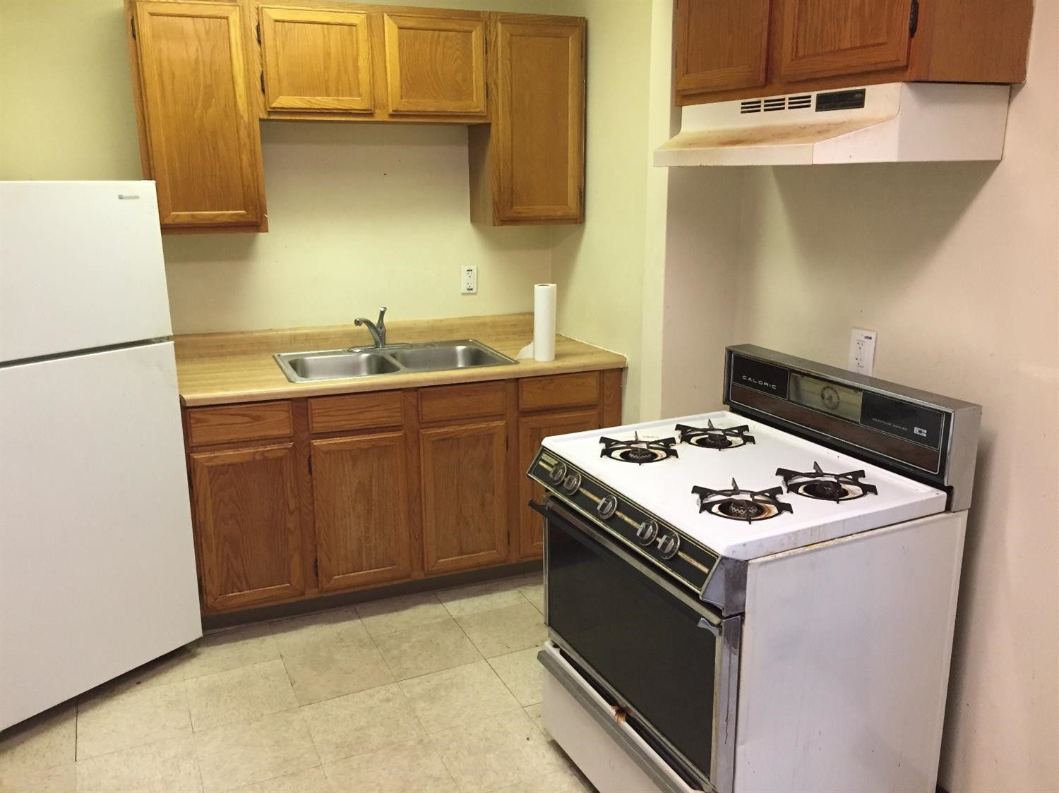 133-39 West Ridge Road Gary, IN 46408 - Photo 25 of 25 a white stove top oven sitting inside of a kitchen