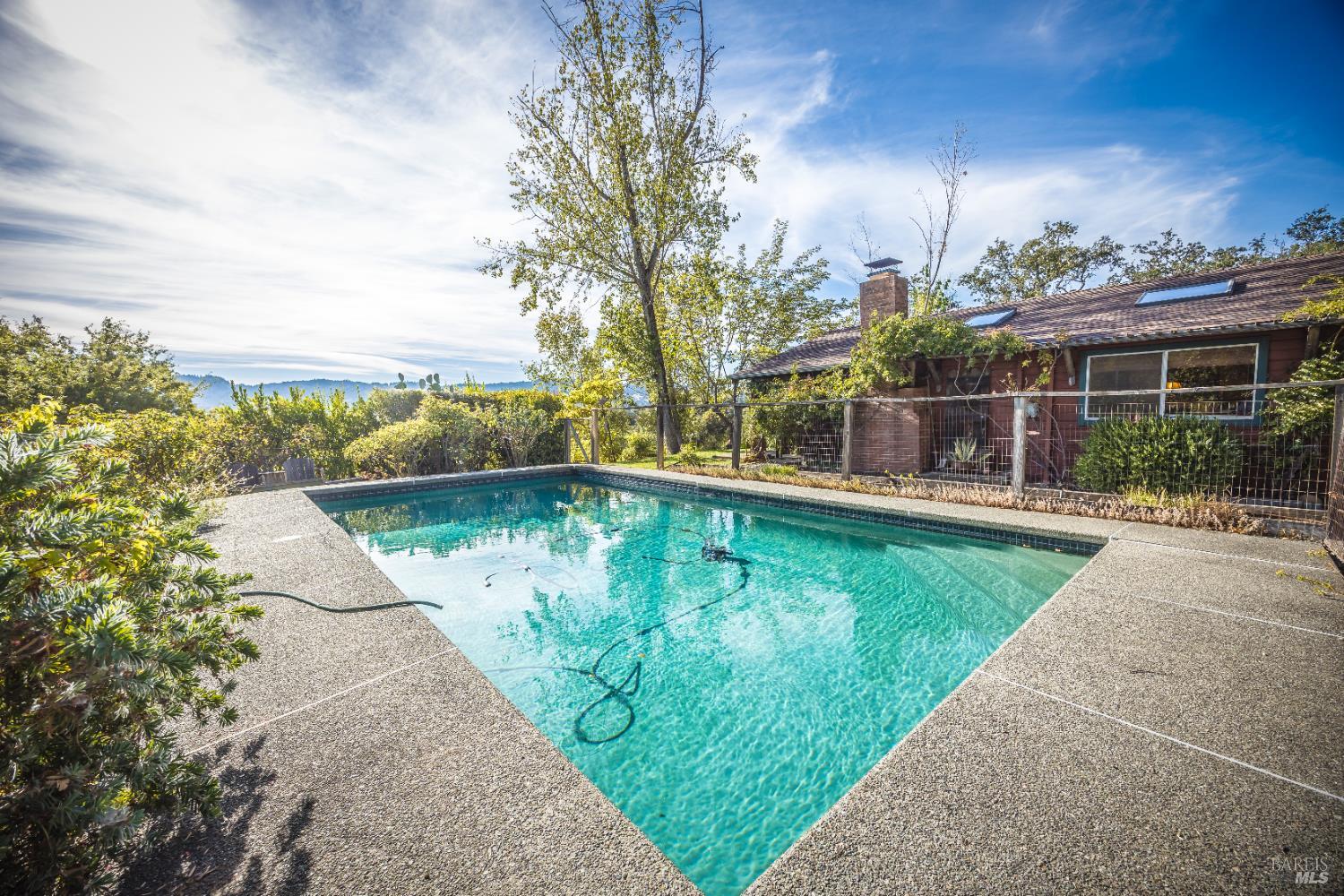 28678 River Road Cloverdale, CA 95425 - Photo 19 of 36 a view of a swimming pool with a patio