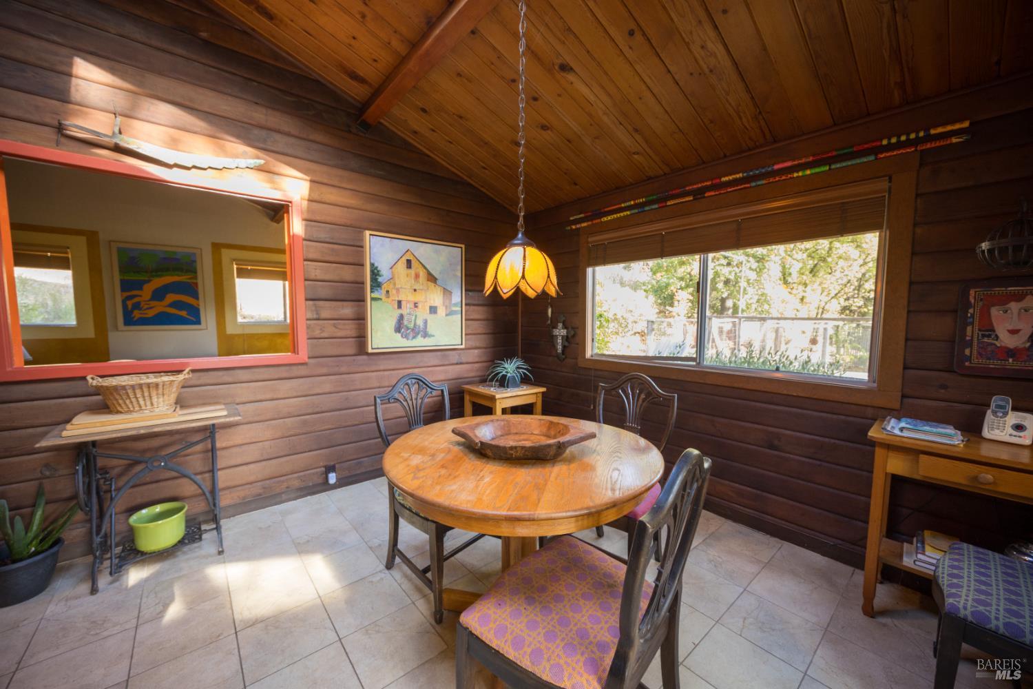 28678 River Road Cloverdale, CA 95425 - Photo 25 of 36 a room with furniture a window and a chandelier