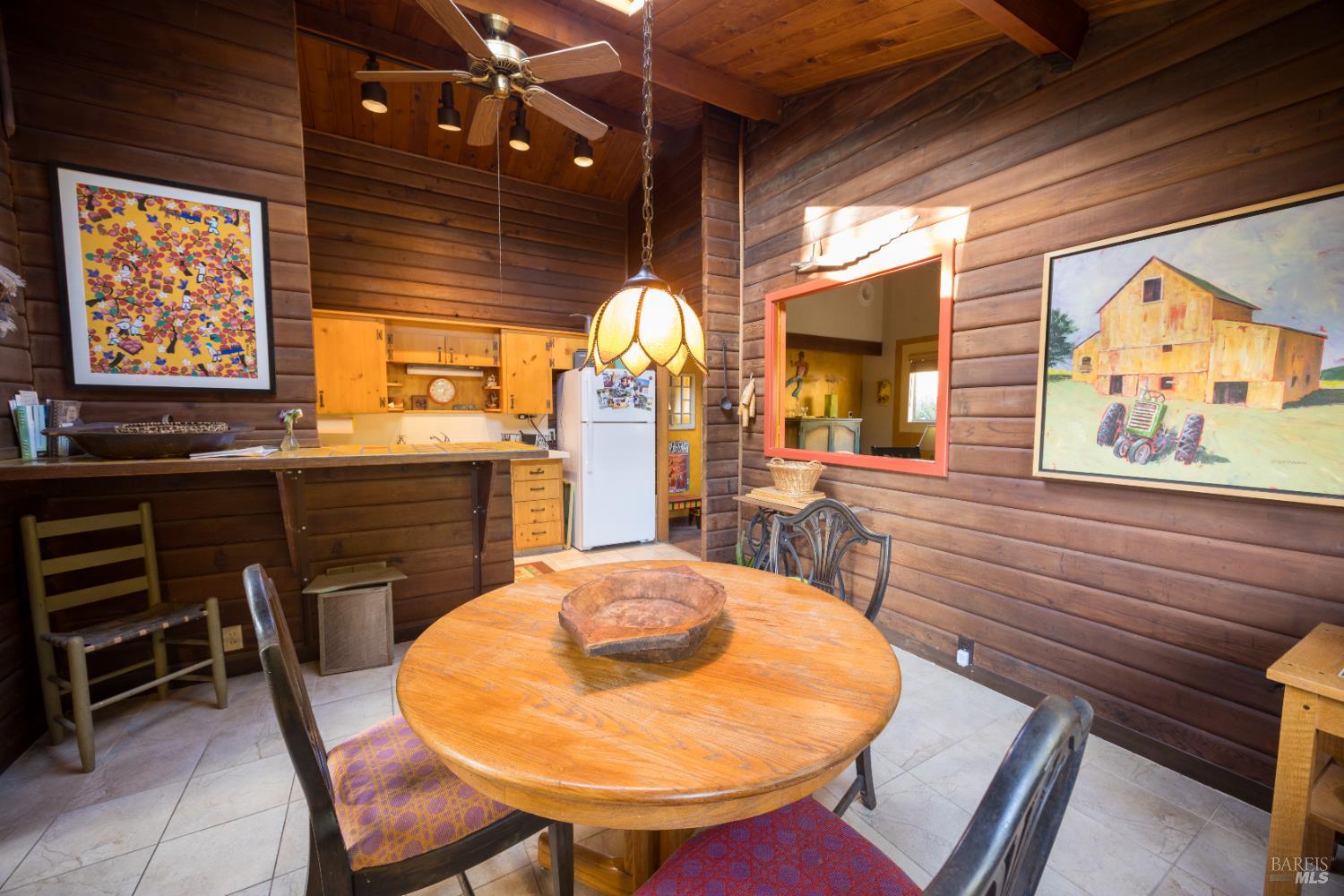 28678 River Road Cloverdale, CA 95425 - Photo 26 of 36 a view of a dining room with furniture and window
