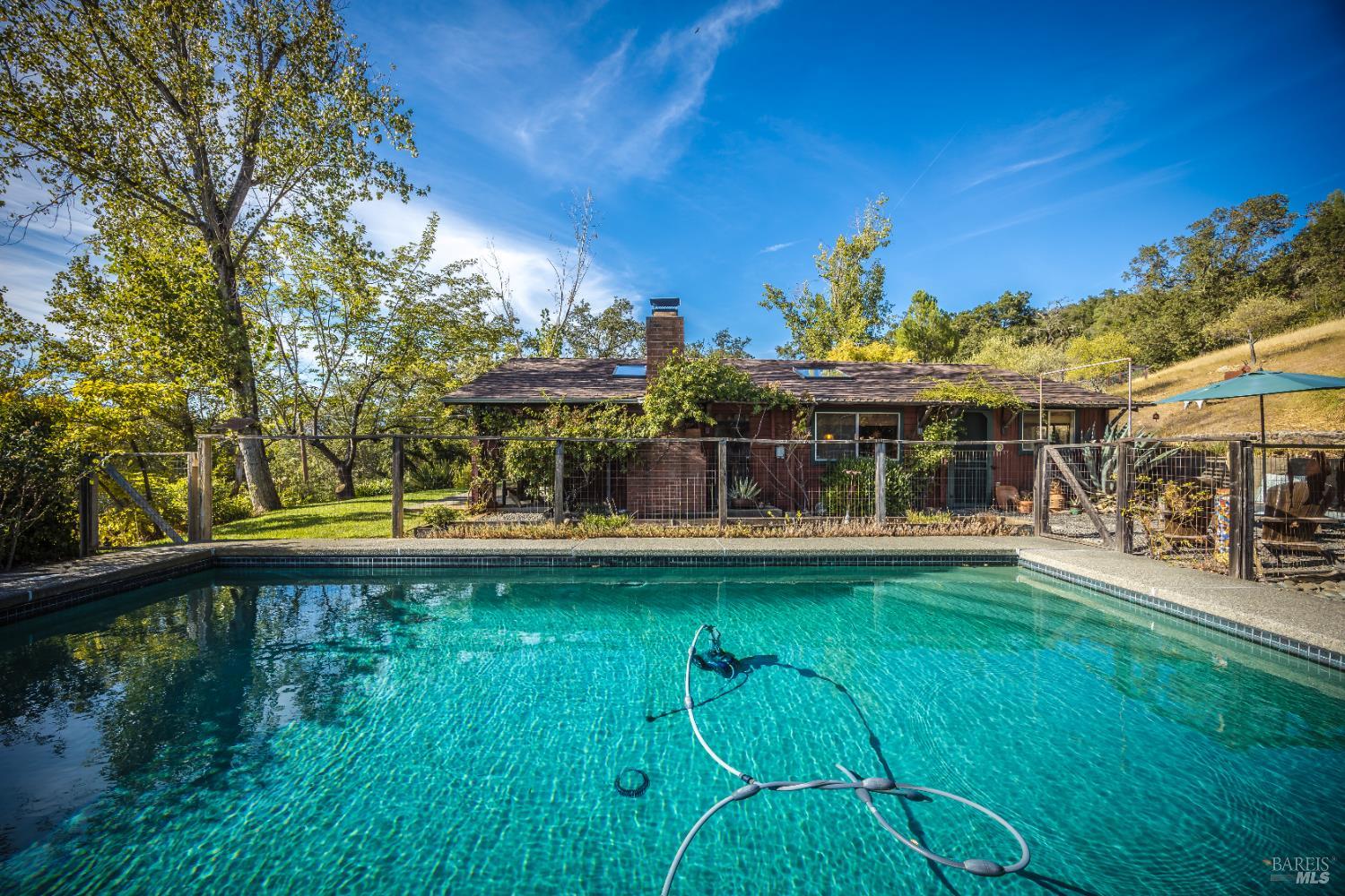 28678 River Road Cloverdale, CA 95425 - Photo 6 of 36 a view of a swimming pool with an outdoor seating