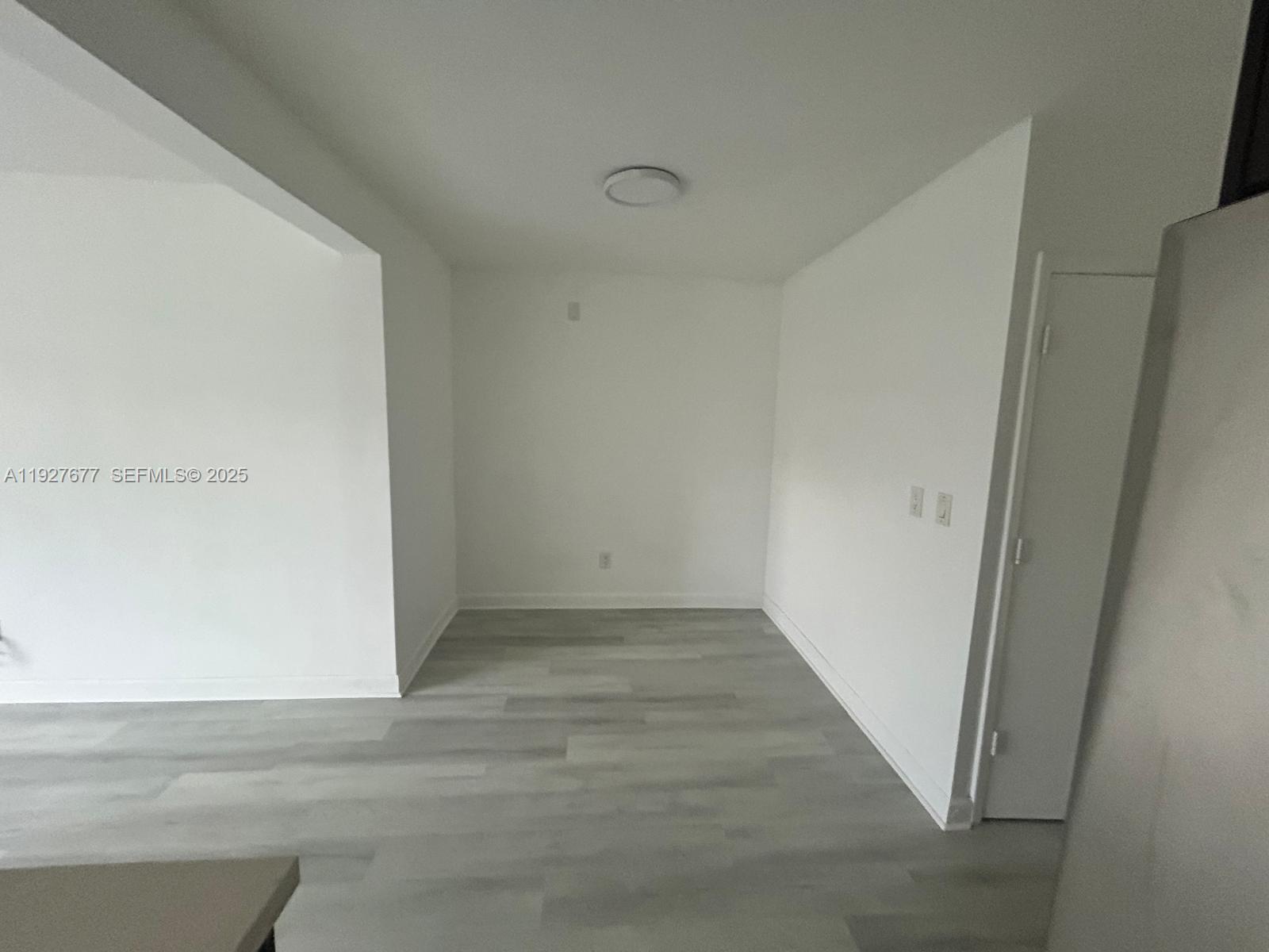 7430 Carlyle Avenue, Unit 2 Miami Beach, FL 33141 - Photo 4 of 8 a view of an empty room