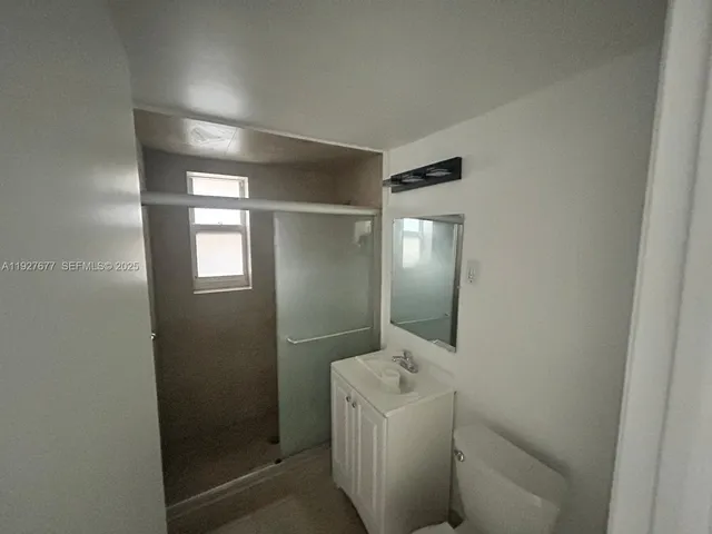 a bathroom with a sink and mirror