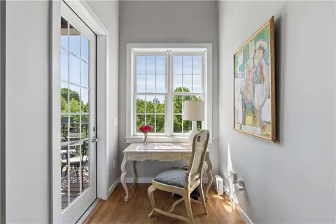 a dining room with furniture and wooden floor