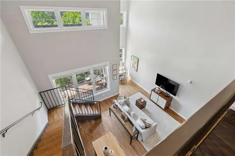 a view of a living room with furniture and a window
