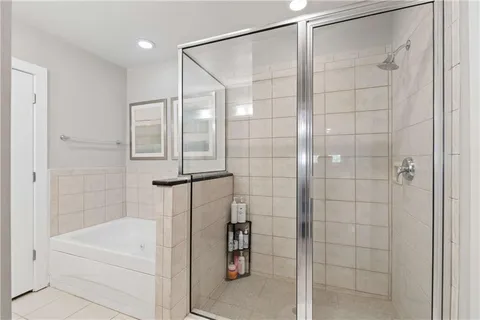 a bathroom with a bathtub and a shower
