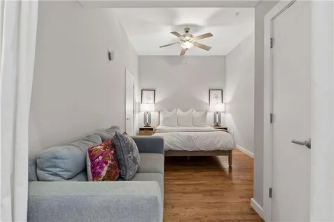 a living room with couches and chandelier