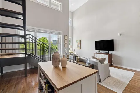 a dining room with furniture and a flat screen tv
