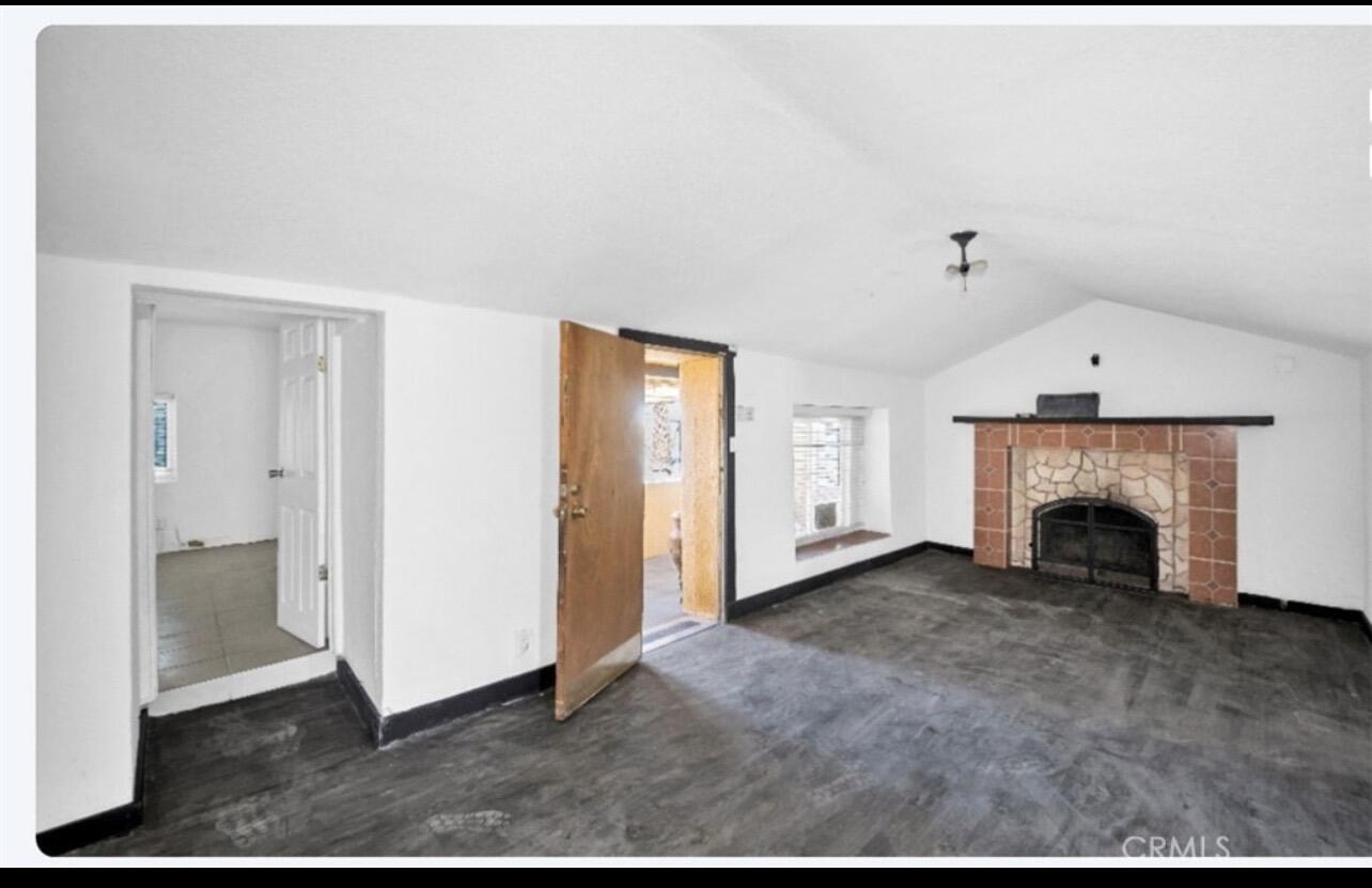 82481 Valencia Avenue Indio, CA 92201 - Photo 2 of 13 a view of an empty room with a fireplace