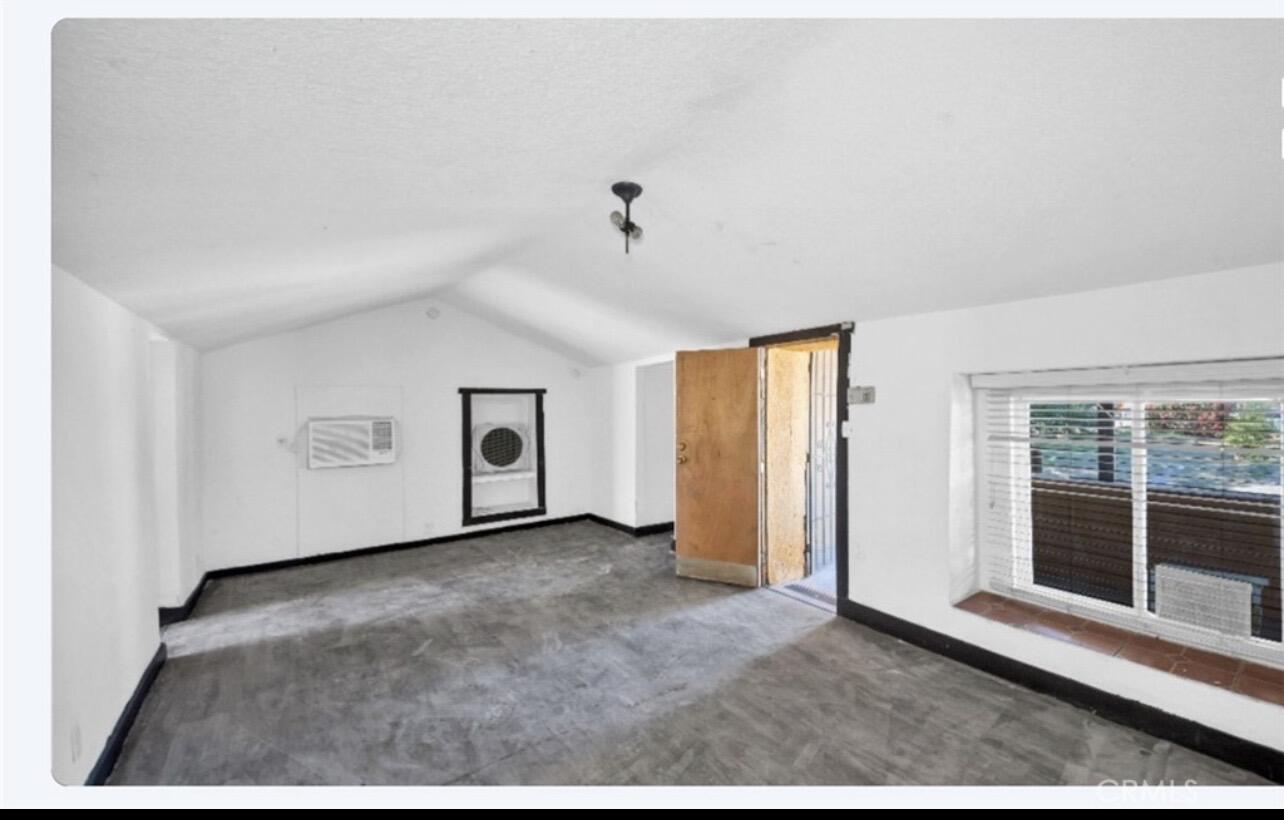 82481 Valencia Avenue Indio, CA 92201 - Photo 3 of 13 a view of an empty room with a window