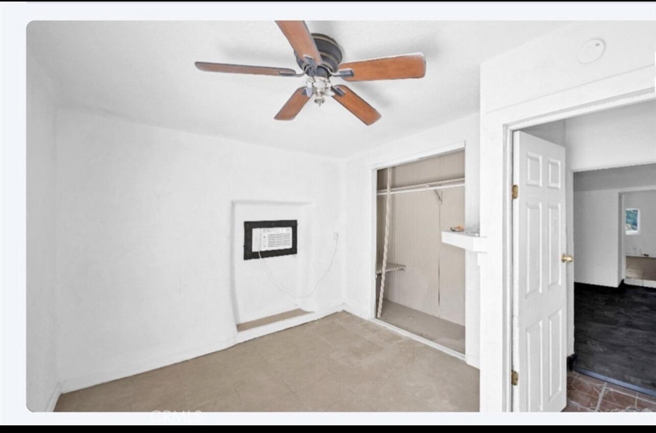 82481 Valencia Avenue Indio, CA 92201 - Photo 5 of 13 a view of a hallway with a ceiling fan