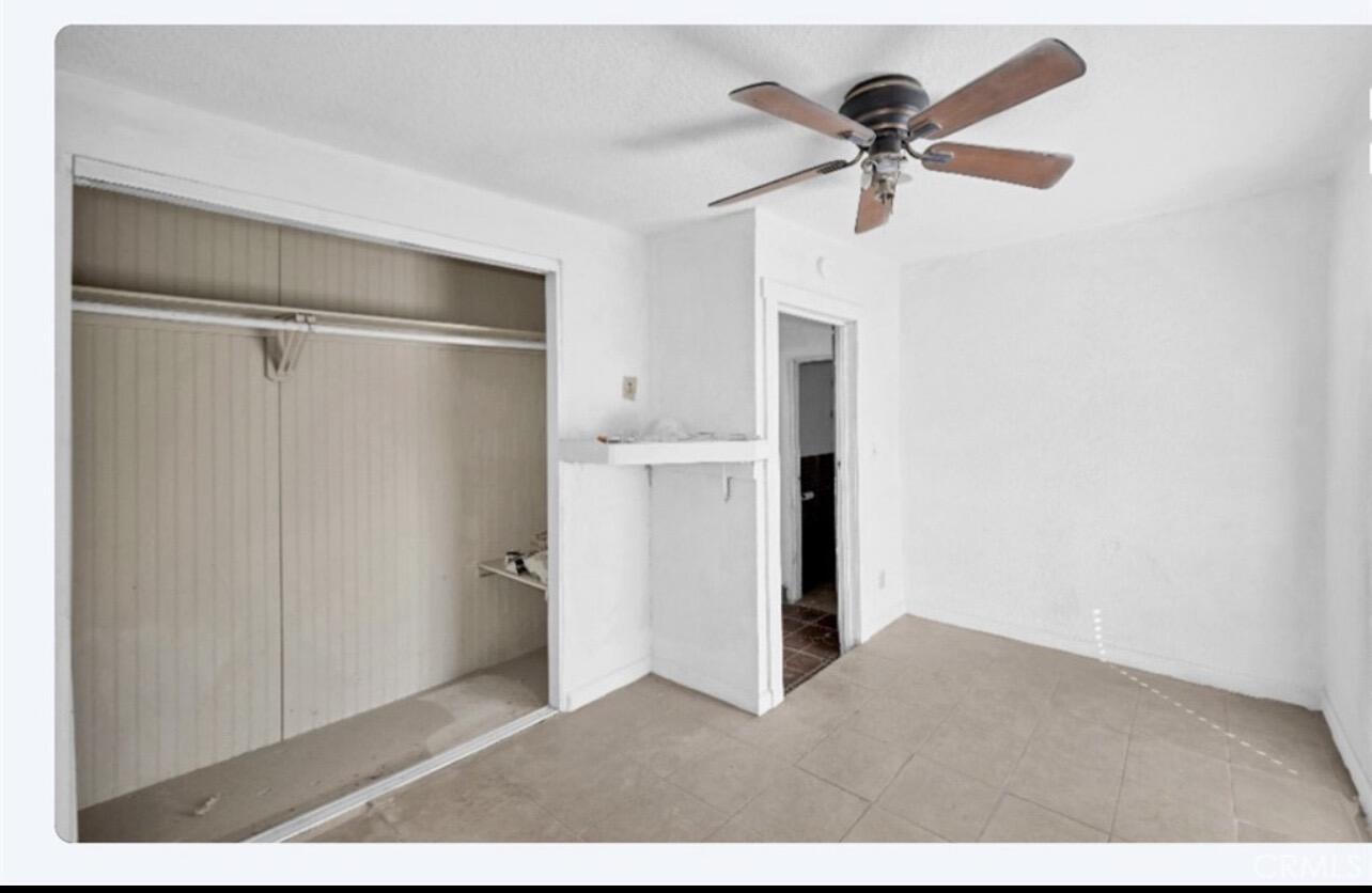 82481 Valencia Avenue Indio, CA 92201 - Photo 6 of 13 a view of empty room with cabinet and ceiling fan