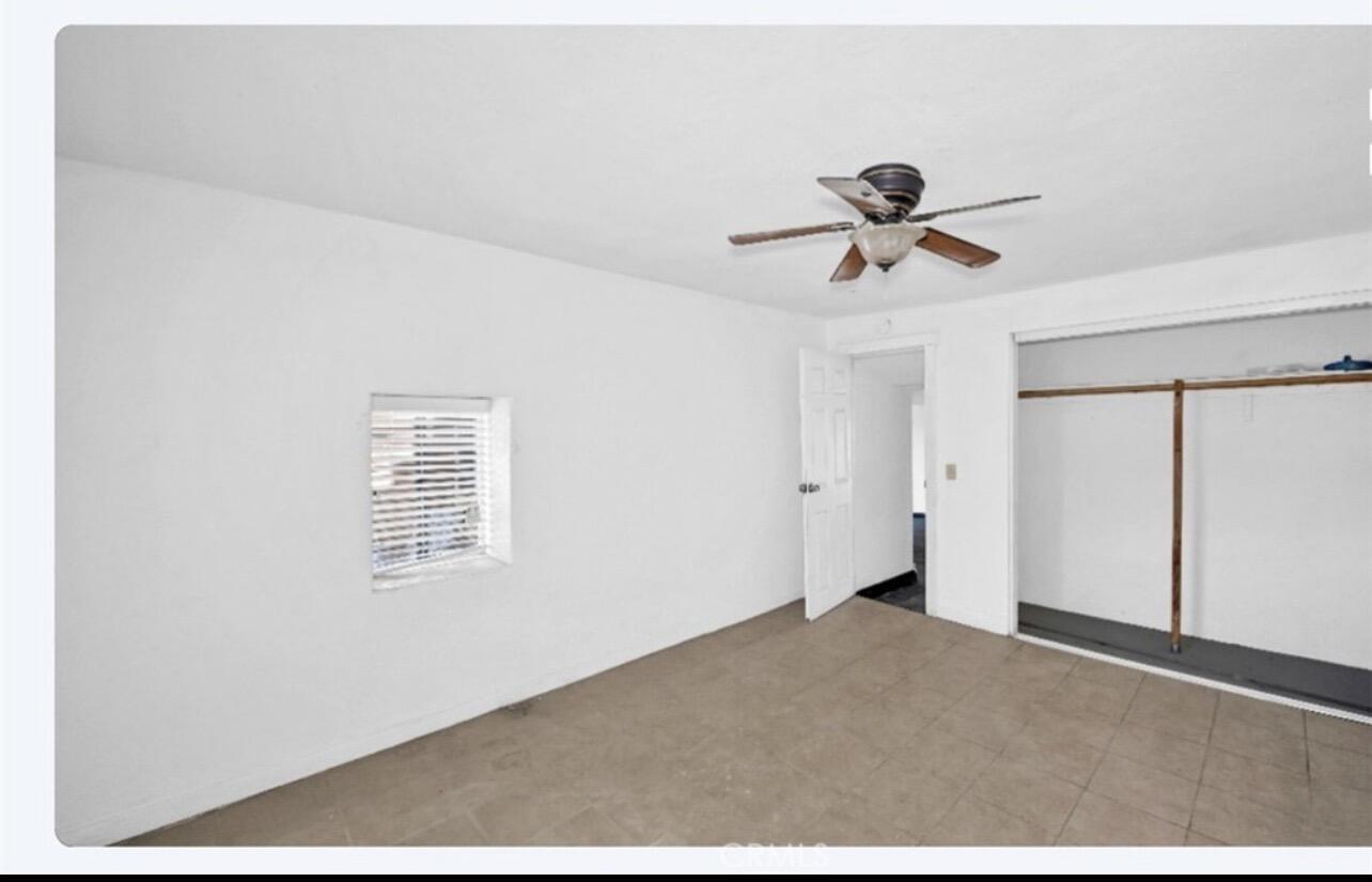82481 Valencia Avenue Indio, CA 92201 - Photo 9 of 13 a view of a room with a ceiling fan and carpet