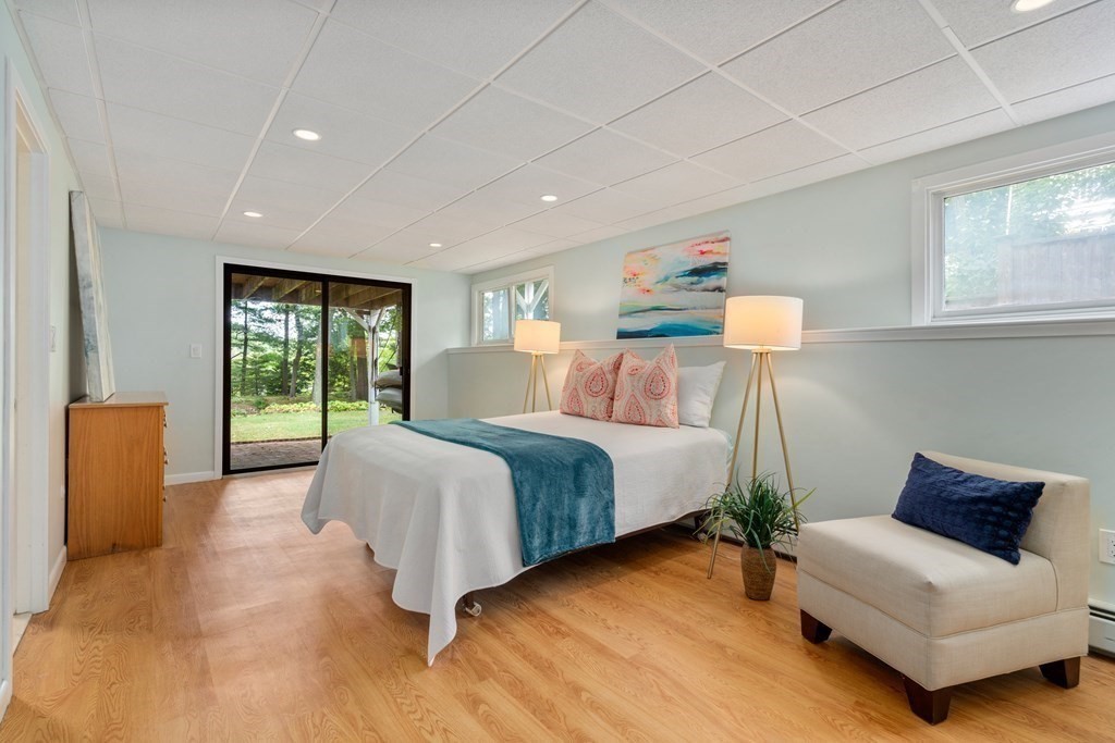 40 Kingswood Road Newton, MA 02466 - Photo 24 of 30 a spacious bedroom with a bed and a couch