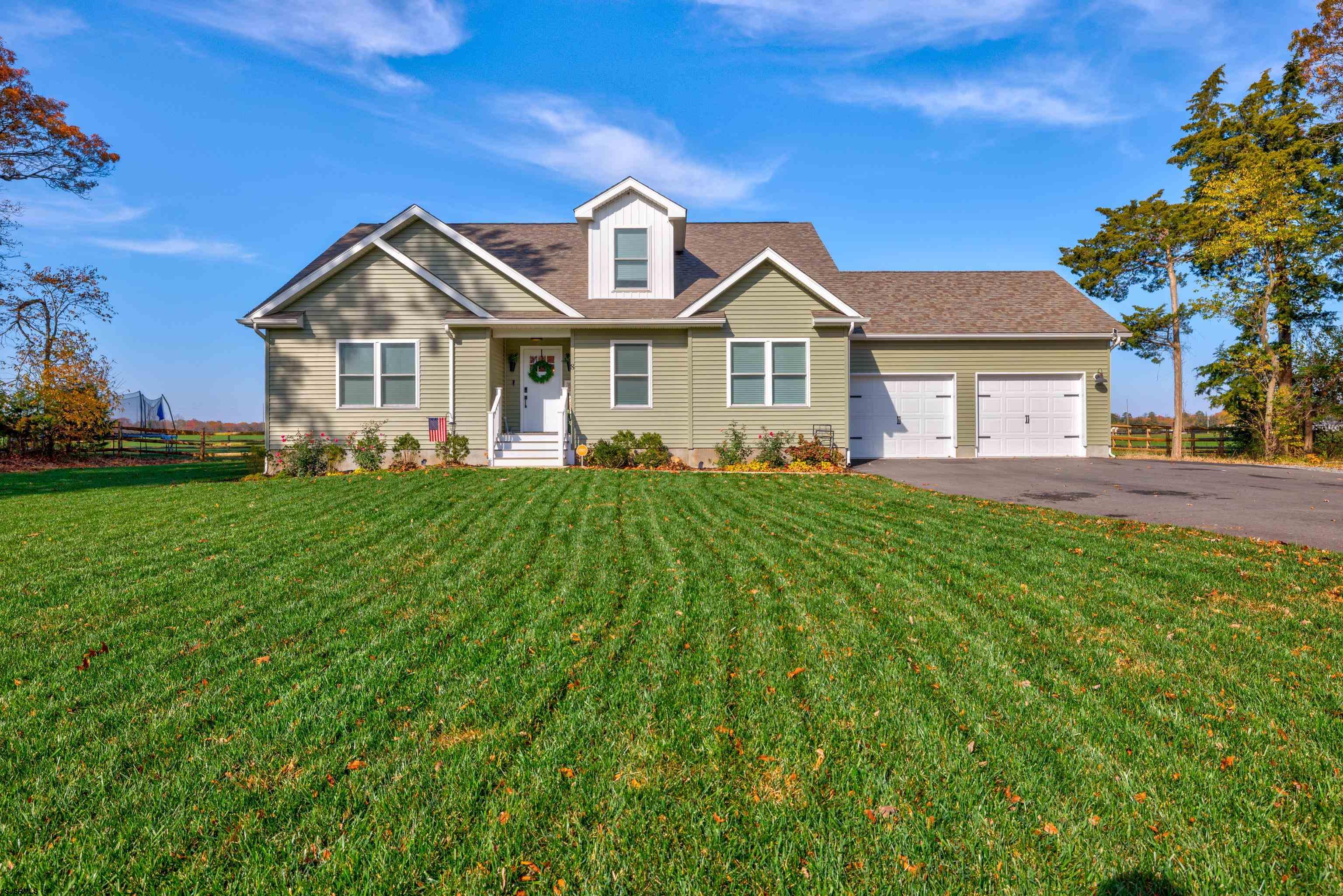 8 Gibson Lane Rio Grande, NJ 08210 - Photo 1 of 45 a front view of a house with a yard