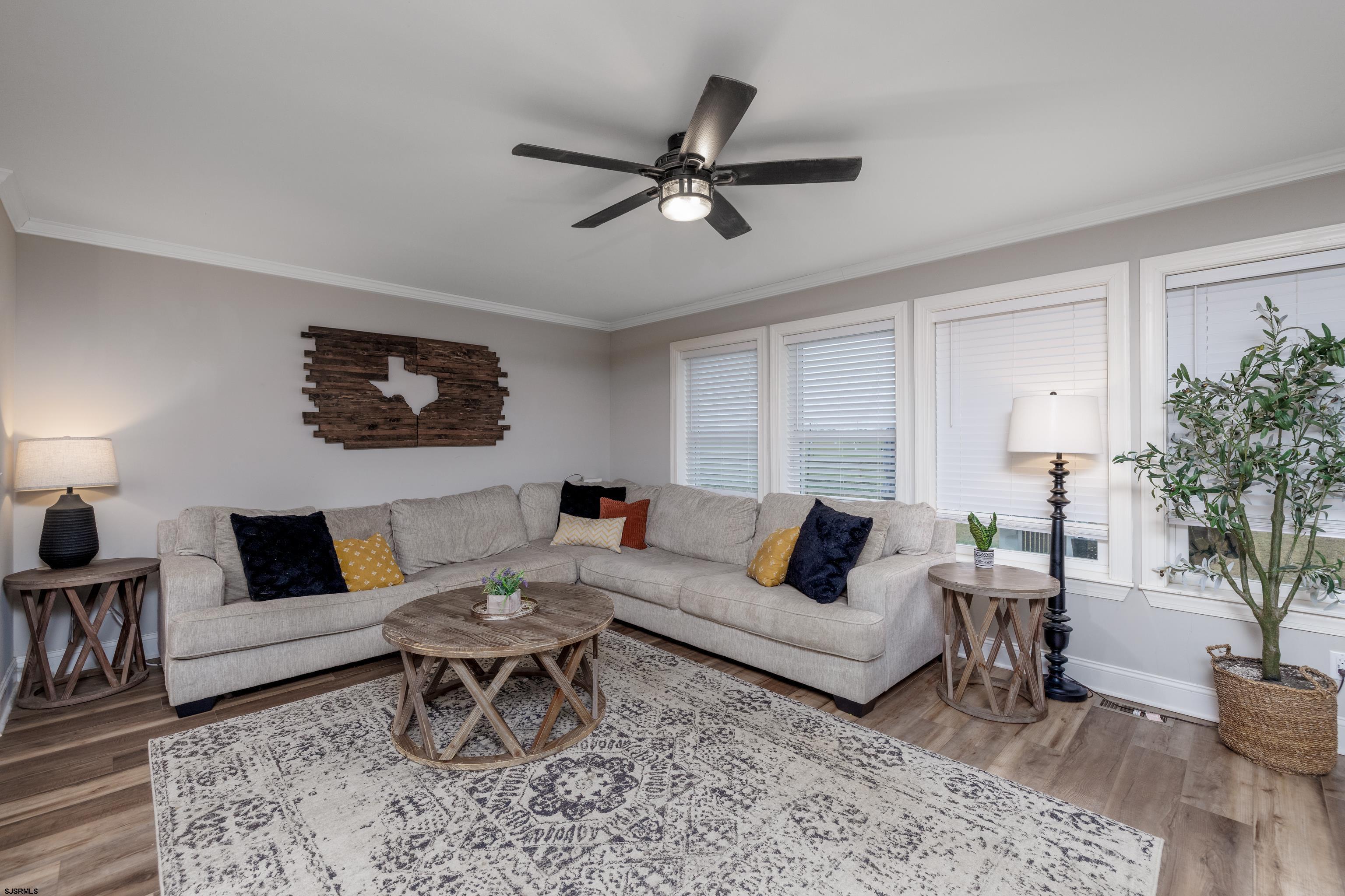 8 Gibson Lane Rio Grande, NJ 08210 - Photo 12 of 45 a living room with furniture and a large window