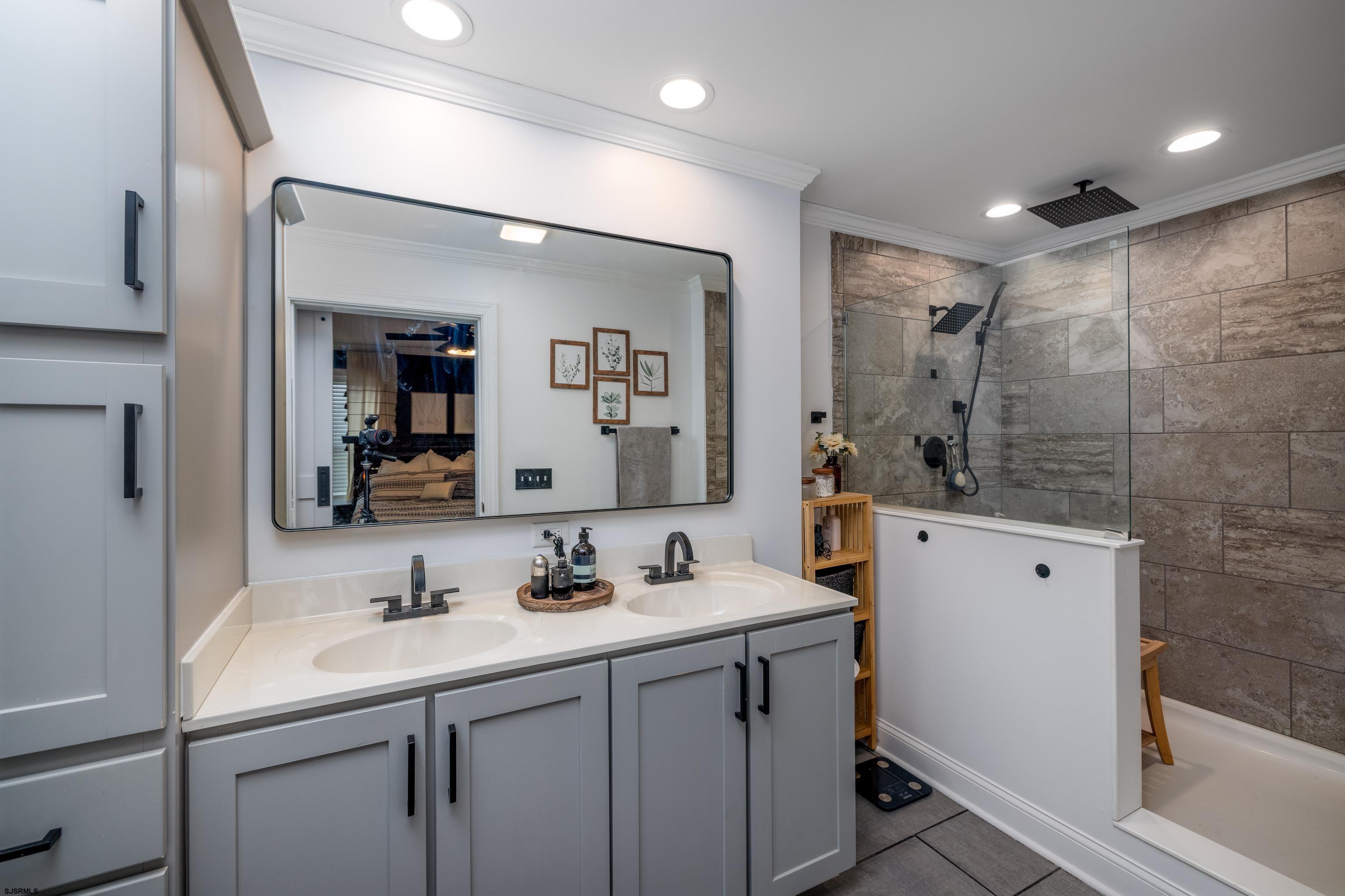 8 Gibson Lane Rio Grande, NJ 08210 - Photo 23 of 45 a bathroom with a double vanity sink mirror and shower