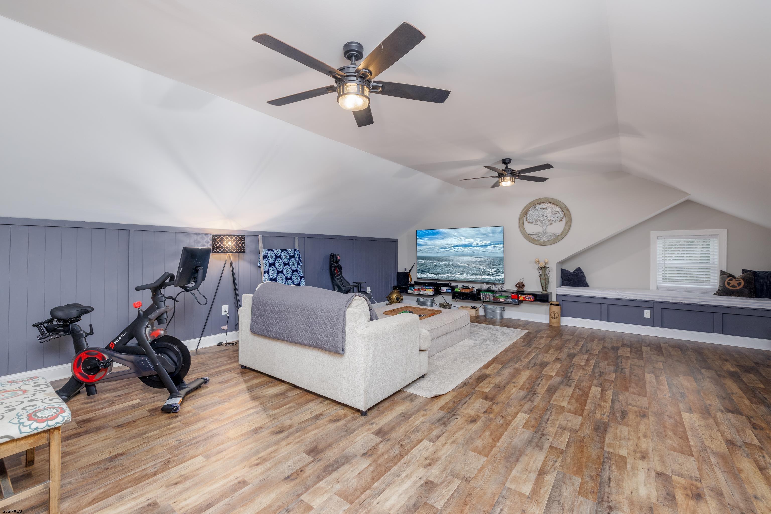 8 Gibson Lane Rio Grande, NJ 08210 - Photo 25 of 45 a view of a livingroom with furniture a ceiling fan and wooden floor