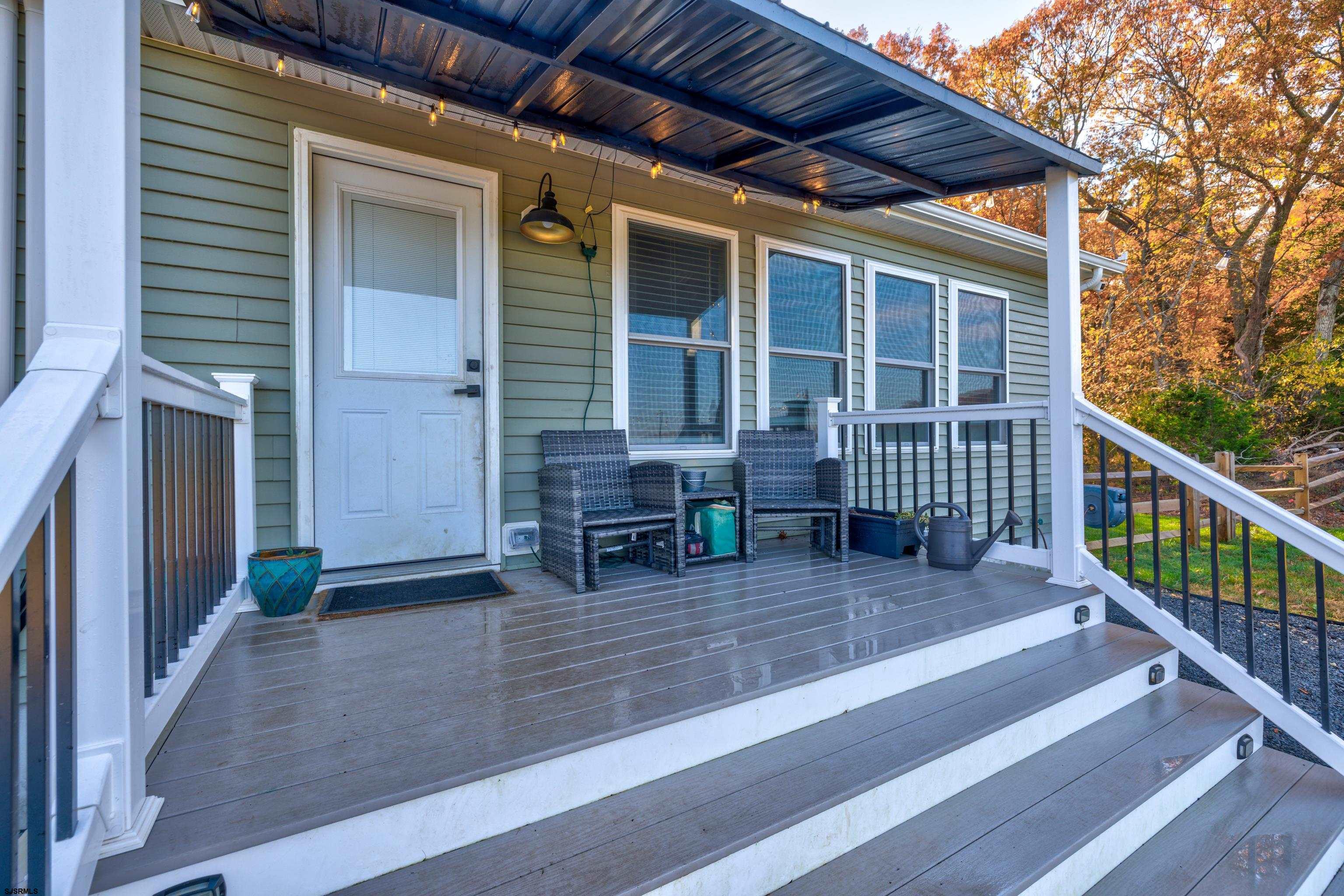 8 Gibson Lane Rio Grande, NJ 08210 - Photo 30 of 45 a view of porch with wooden floor and seating space