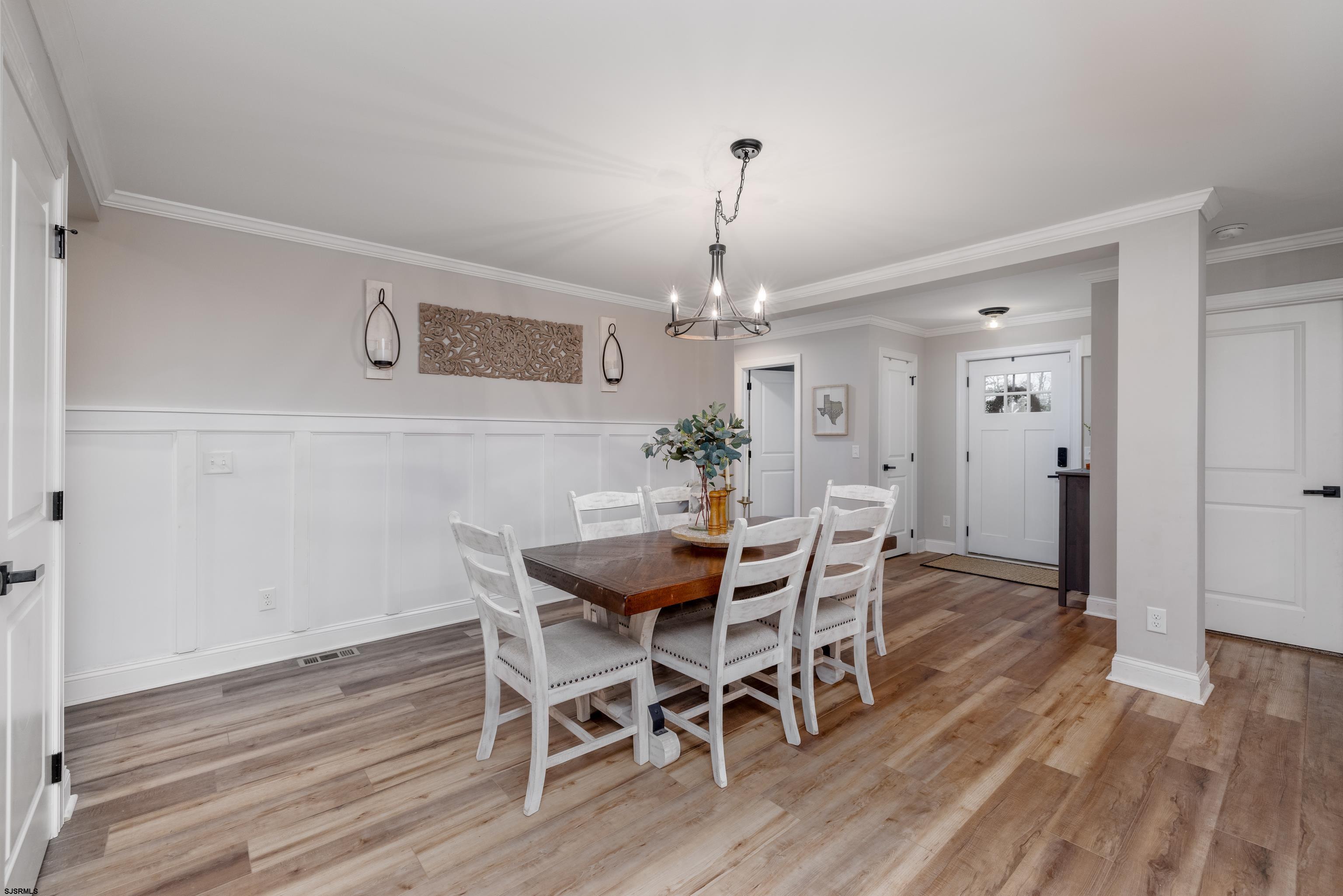 8 Gibson Lane Rio Grande, NJ 08210 - Photo 4 of 45 a view of a dining room with furniture and wooden floor