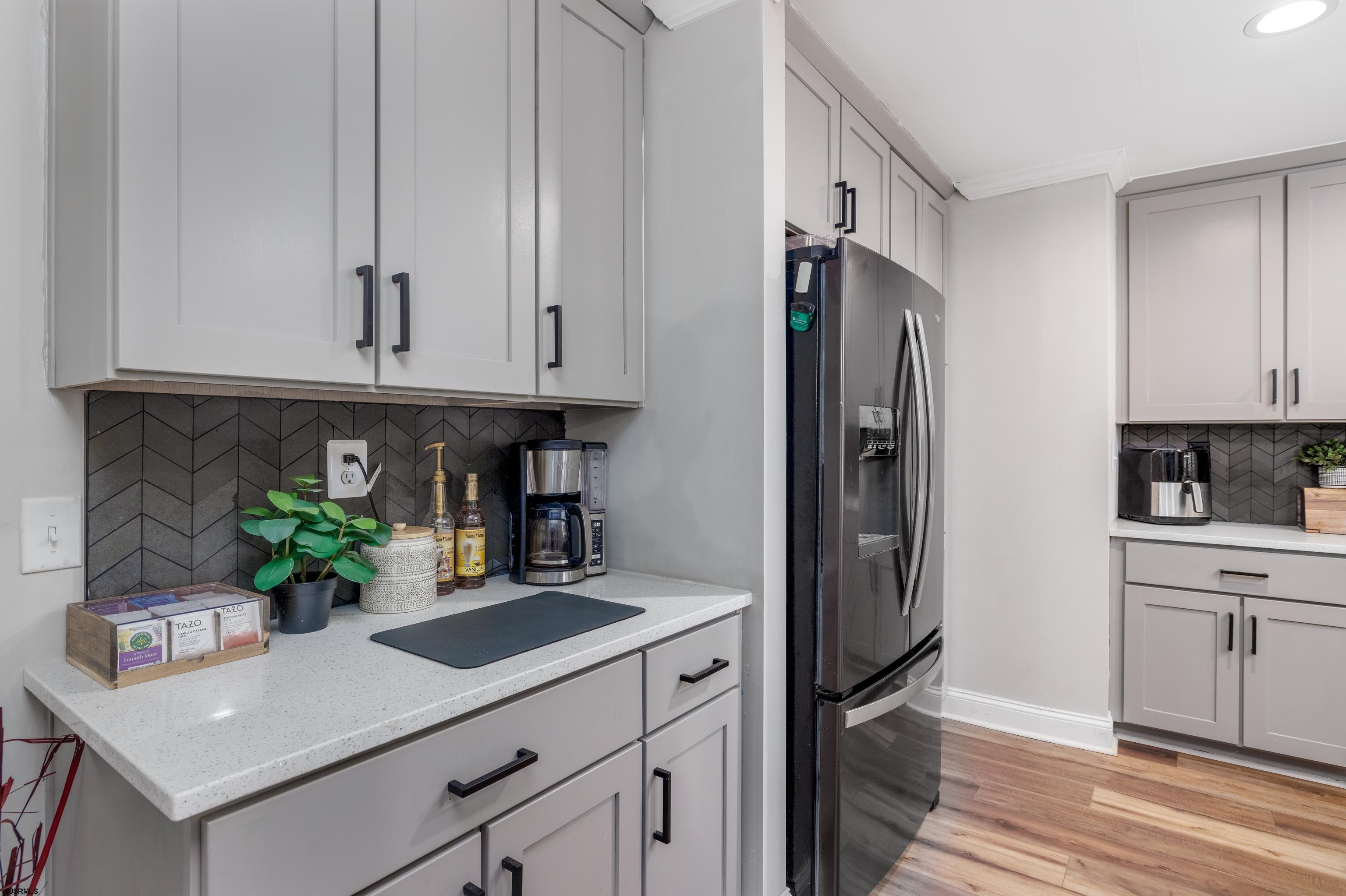8 Gibson Lane Rio Grande, NJ 08210 - Photo 6 of 45 a kitchen with stainless steel appliances a counter space and cabinets