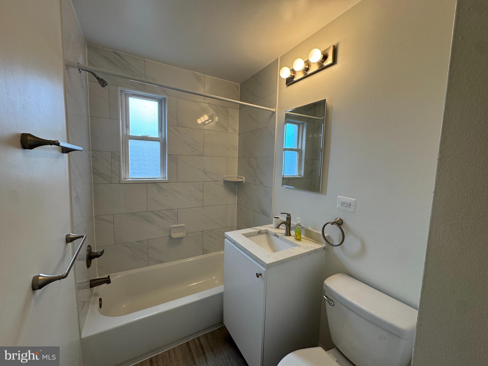 500 South Courthouse Road, Unit 12 Arlington, VA 22204 - Photo 12 of 21 a bathroom with a toilet a sink and bathtub