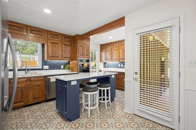 a kitchen with a sink cabinets and window