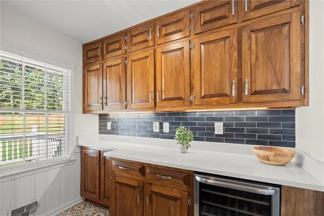 a kitchen with stainless steel appliances a sink dishwasher window and cabinets