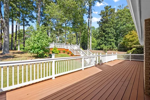 a view of a balcony with wooden floor