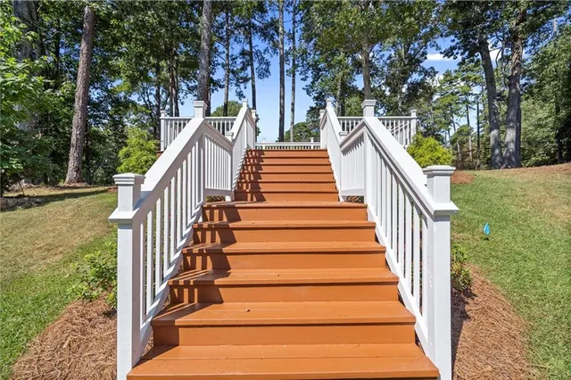 a view of a wooden deck and a yard