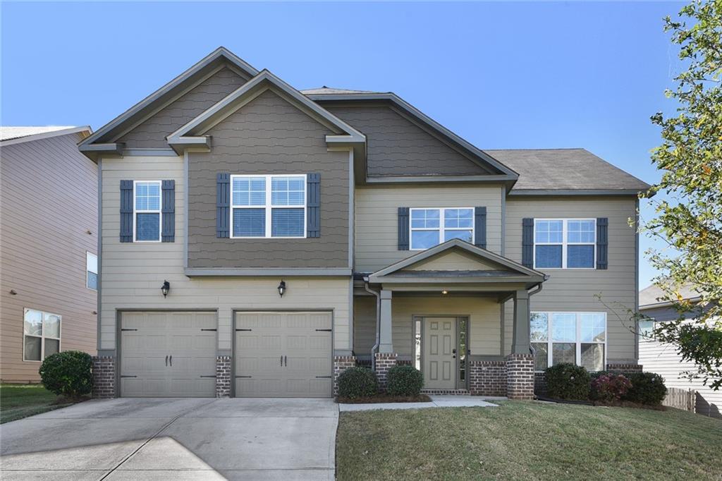 5075 Rialto Way Cumming, GA 30040 - Photo 1 of 1 a front view of a house with garden