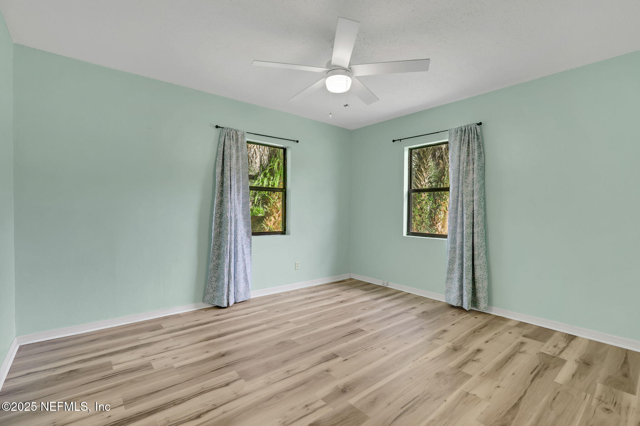 466 Aiken Road Jacksonville, FL 32216 - Photo 17 of 36 a view of empty room with wooden floor