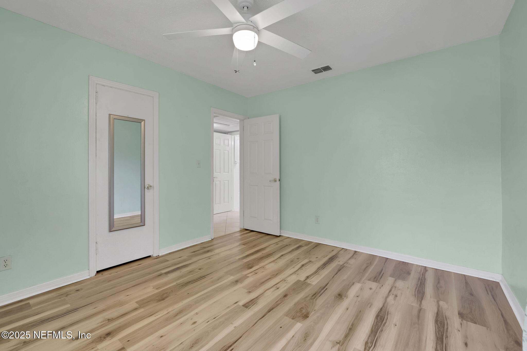466 Aiken Road Jacksonville, FL 32216 - Photo 18 of 36 wooden floor in an empty room