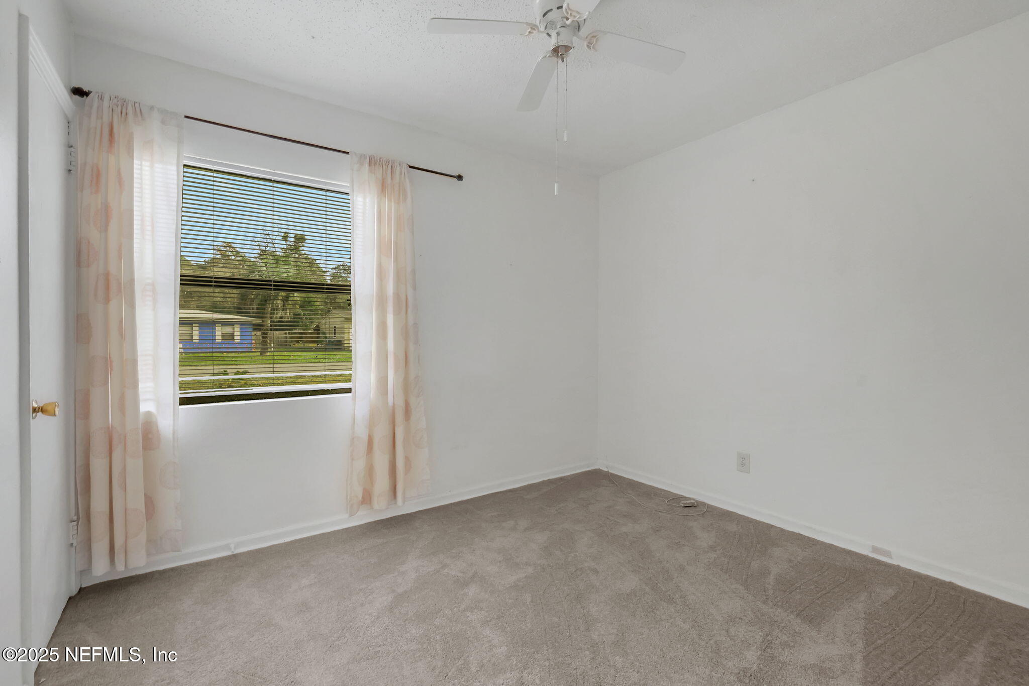 466 Aiken Road Jacksonville, FL 32216 - Photo 26 of 36 a view of an empty room with a window