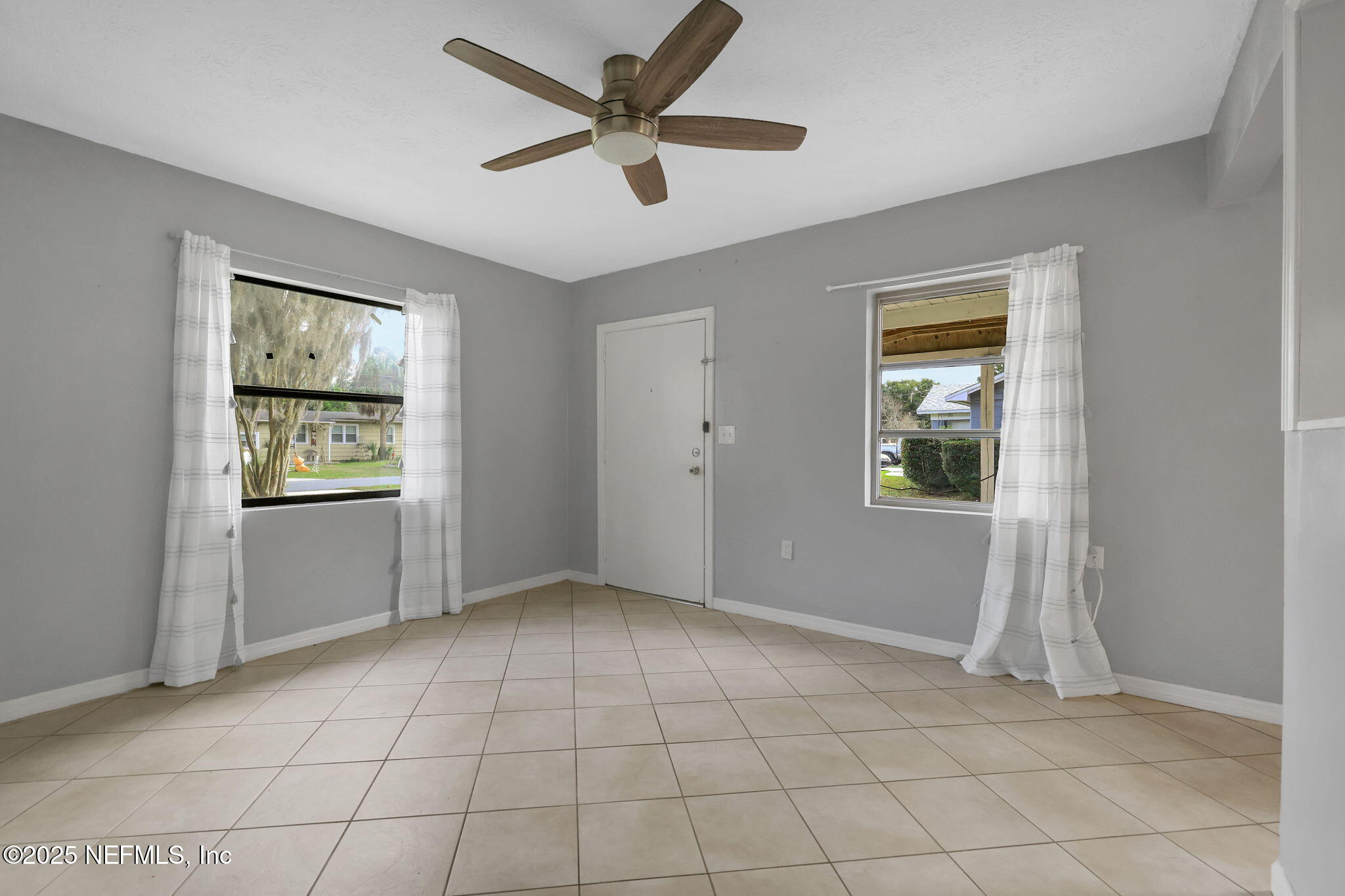 466 Aiken Road Jacksonville, FL 32216 - Photo 7 of 36 a view of an empty room with a window