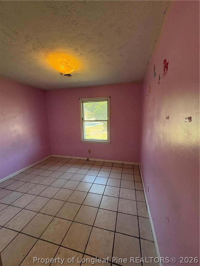 6324 Stoney Point Loop Fayetteville, NC 28306 - Photo 13 of 24 a view of an empty room and window
