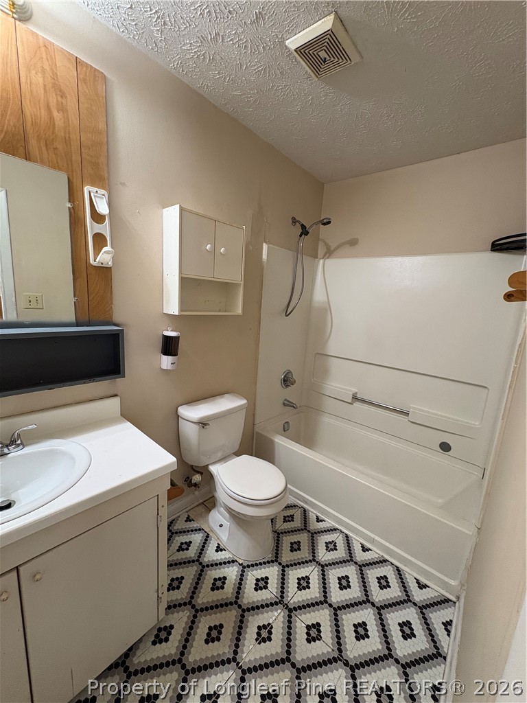 6324 Stoney Point Loop Fayetteville, NC 28306 - Photo 23 of 24 a bathroom with a sink a toilet and shower