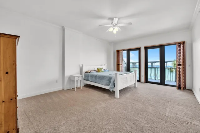 a spacious bedroom with a bed and a table