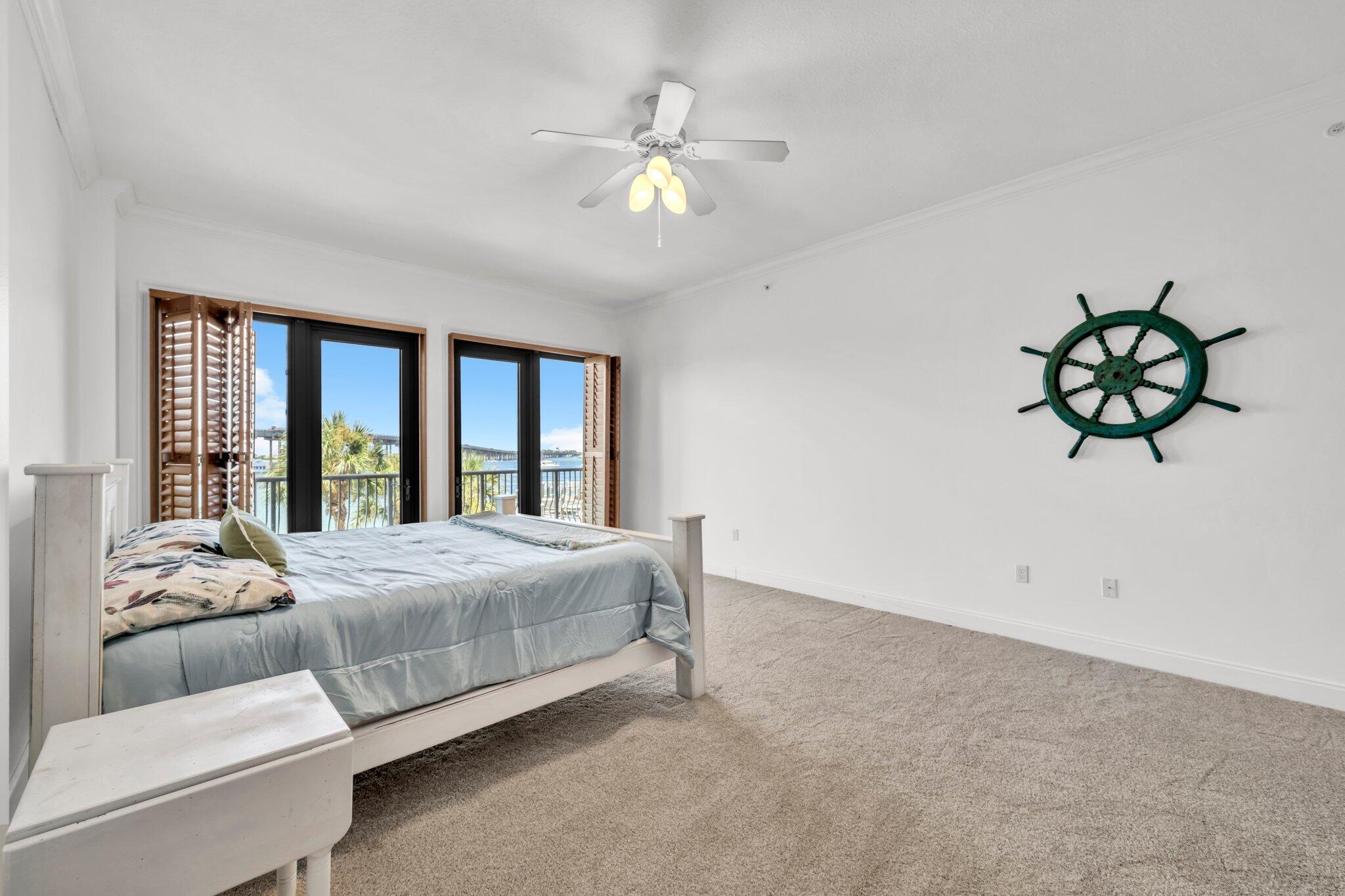 5 Calhoun Avenue, Unit 203 Destin, FL 32541 - Photo 24 of 67 a bedroom with a large bed and a window