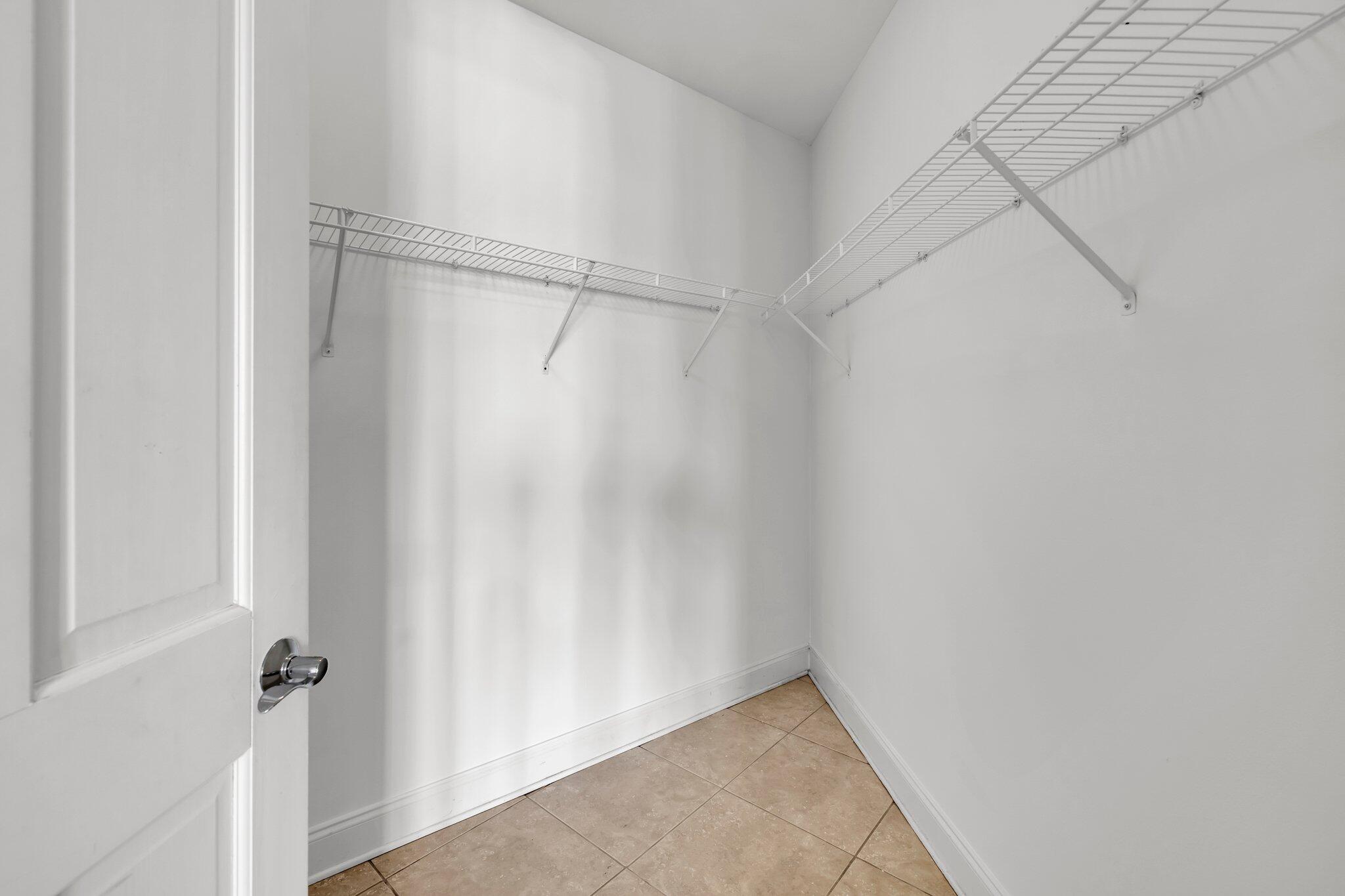 5 Calhoun Avenue, Unit 203 Destin, FL 32541 - Photo 32 of 67 Primary Walk-In Closet