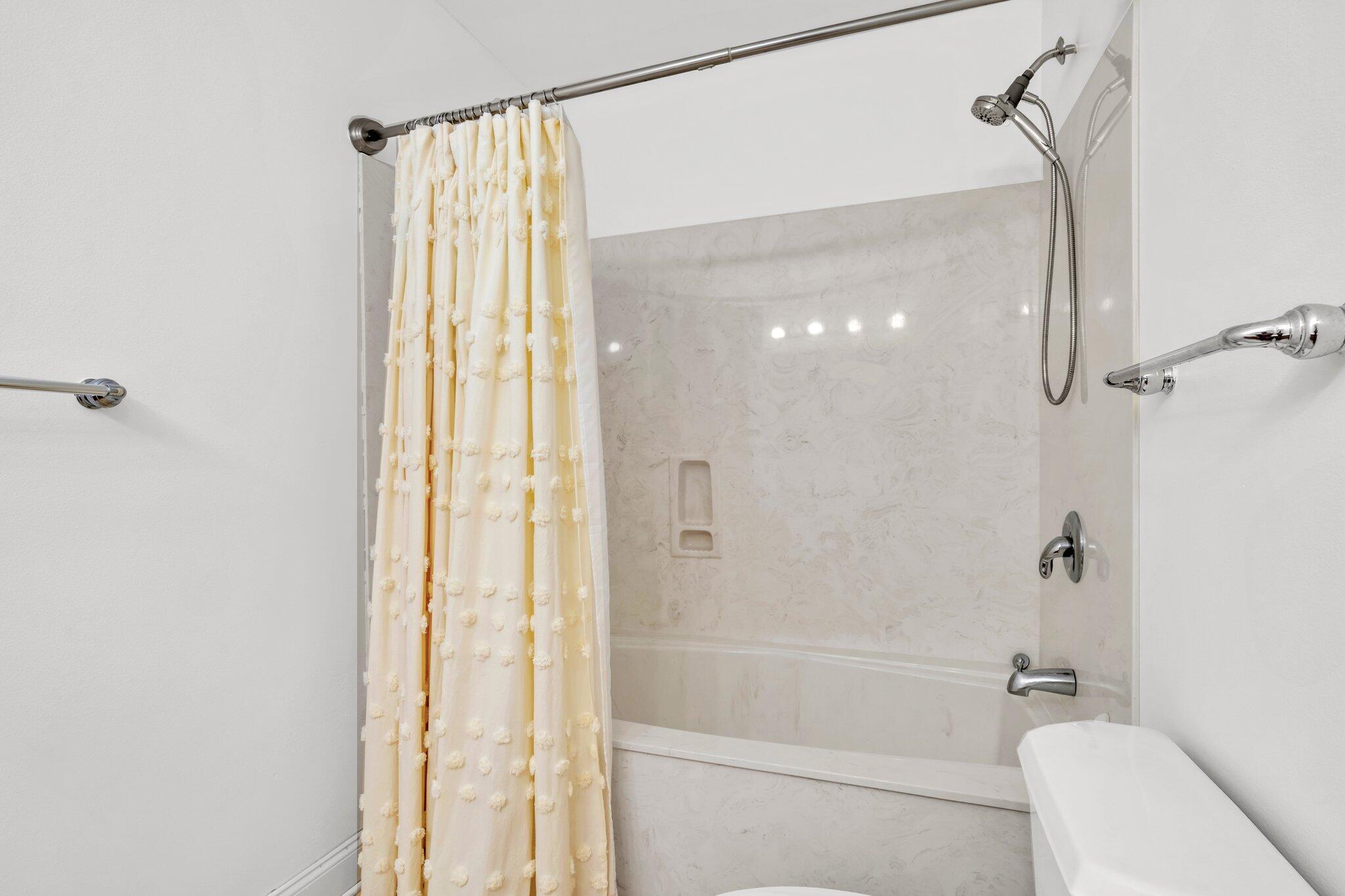 5 Calhoun Avenue, Unit 203 Destin, FL 32541 - Photo 37 of 67 a bathroom with a shower and a toilet