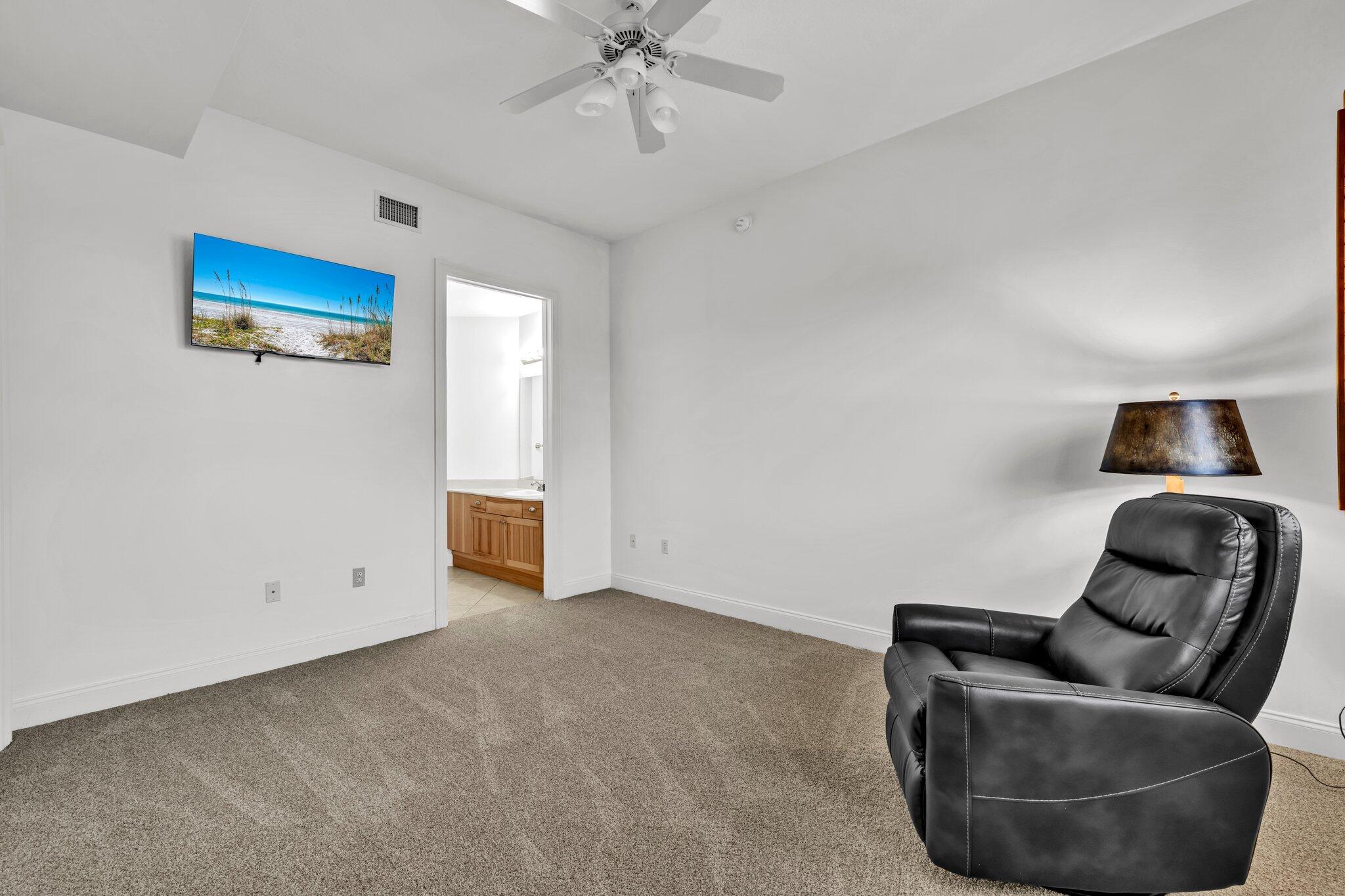 5 Calhoun Avenue, Unit 203 Destin, FL 32541 - Photo 38 of 67 a living room with furniture and a ceiling fan