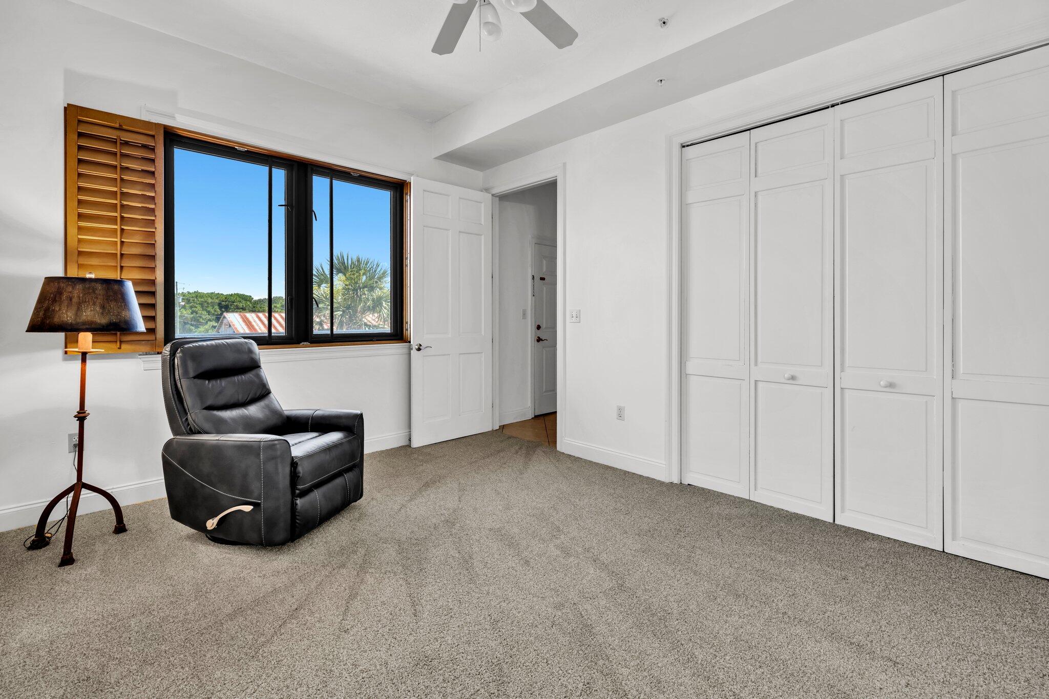 5 Calhoun Avenue, Unit 203 Destin, FL 32541 - Photo 39 of 67 a living room with furniture and a window