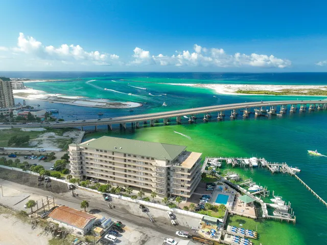 an aerial view of a house with a lake view