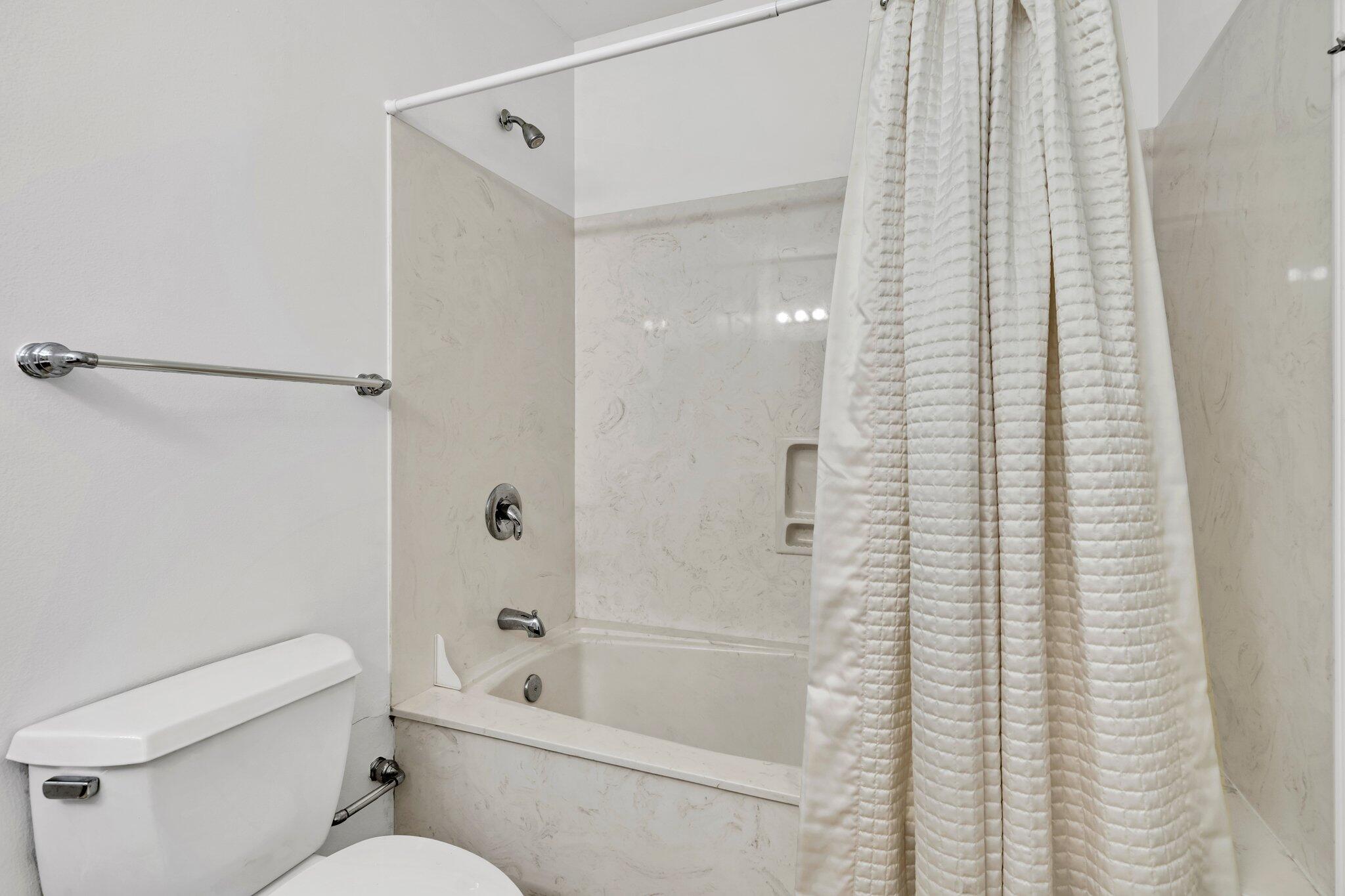 5 Calhoun Avenue, Unit 203 Destin, FL 32541 - Photo 41 of 67 a bathroom with a toilet and a bathtub