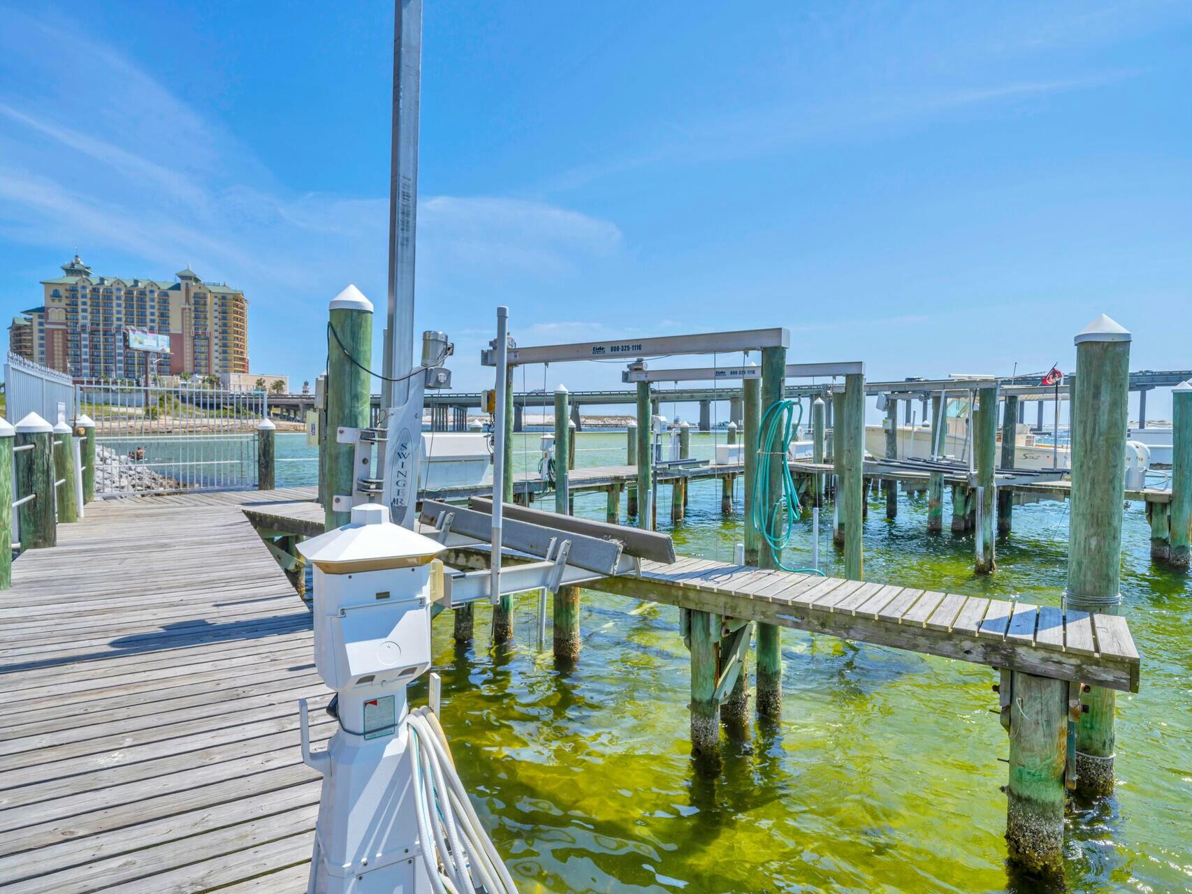 5 Calhoun Avenue, Unit 203 Destin, FL 32541 - Photo 46 of 67 a swimming pool with outdoor seating and yard