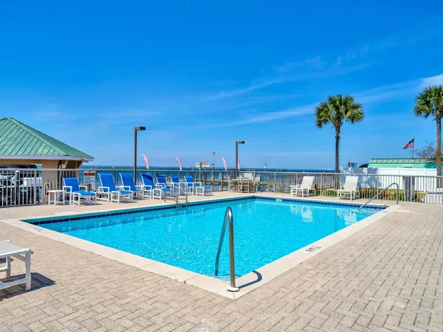 a view of a swimming pool and an outdoor space