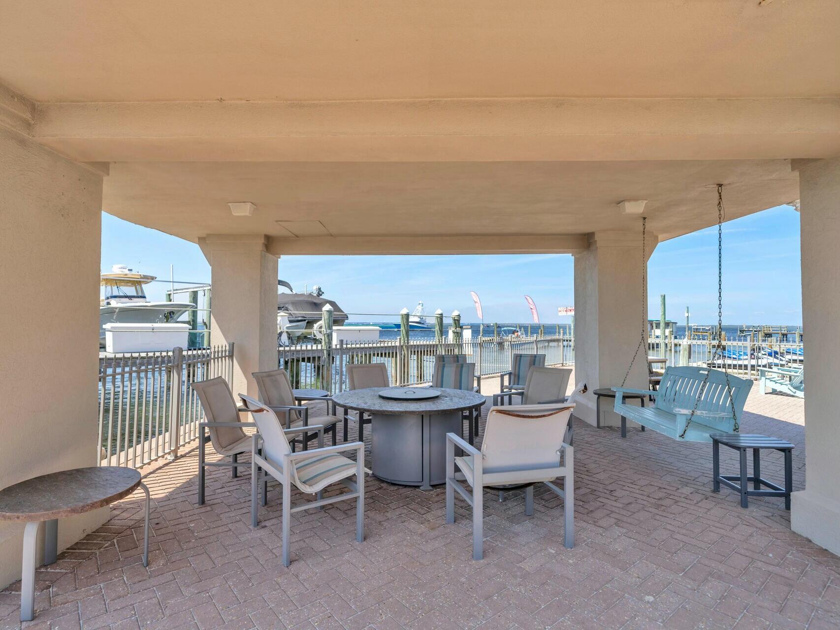 5 Calhoun Avenue, Unit 203 Destin, FL 32541 - Photo 48 of 67 a view of a dining room with furniture window and outside view